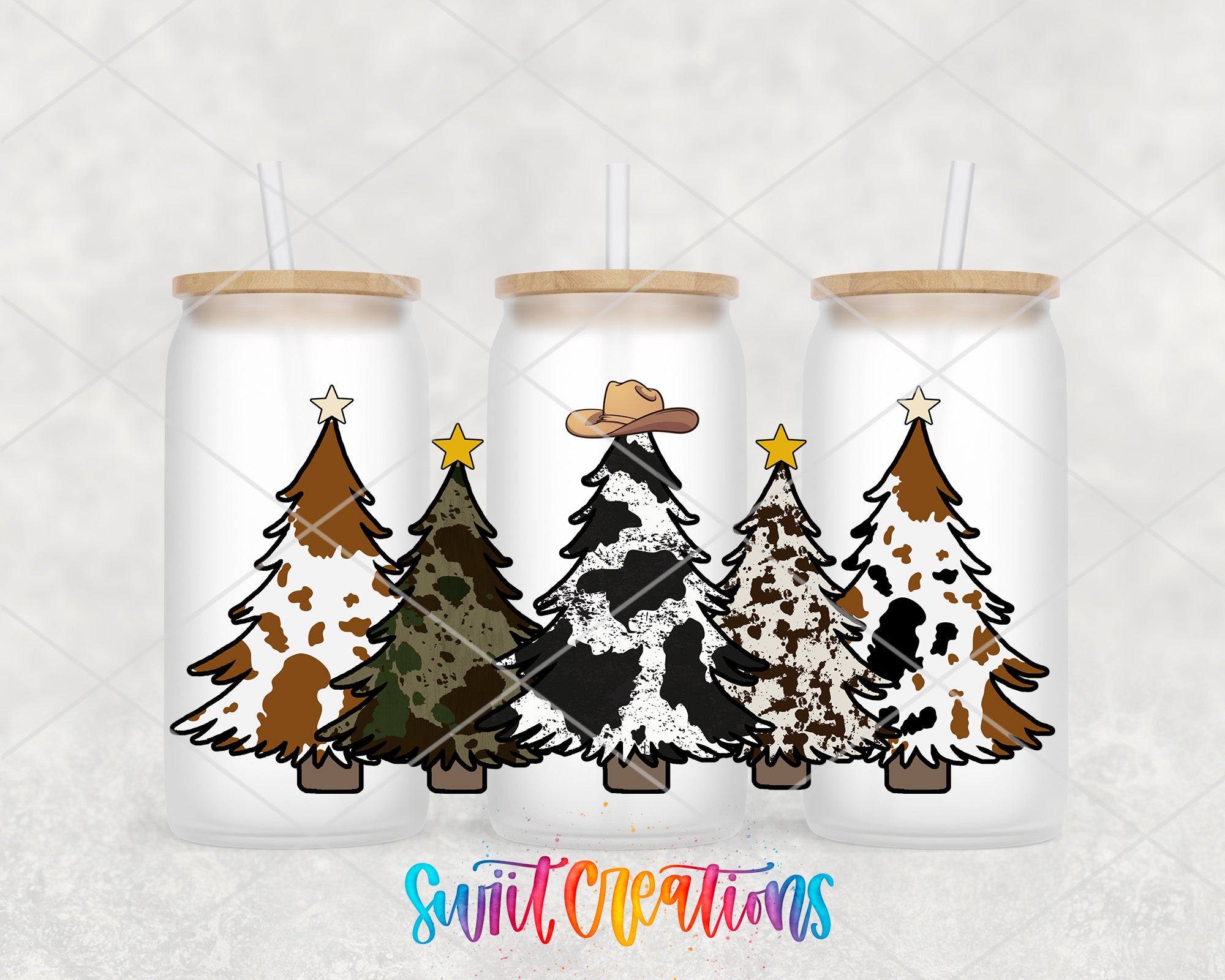 Three glass tumblers with Christmas tree designs on them, each featuring a different color and pattern of trees.