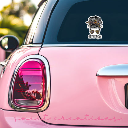 a pink car with a sticker on it