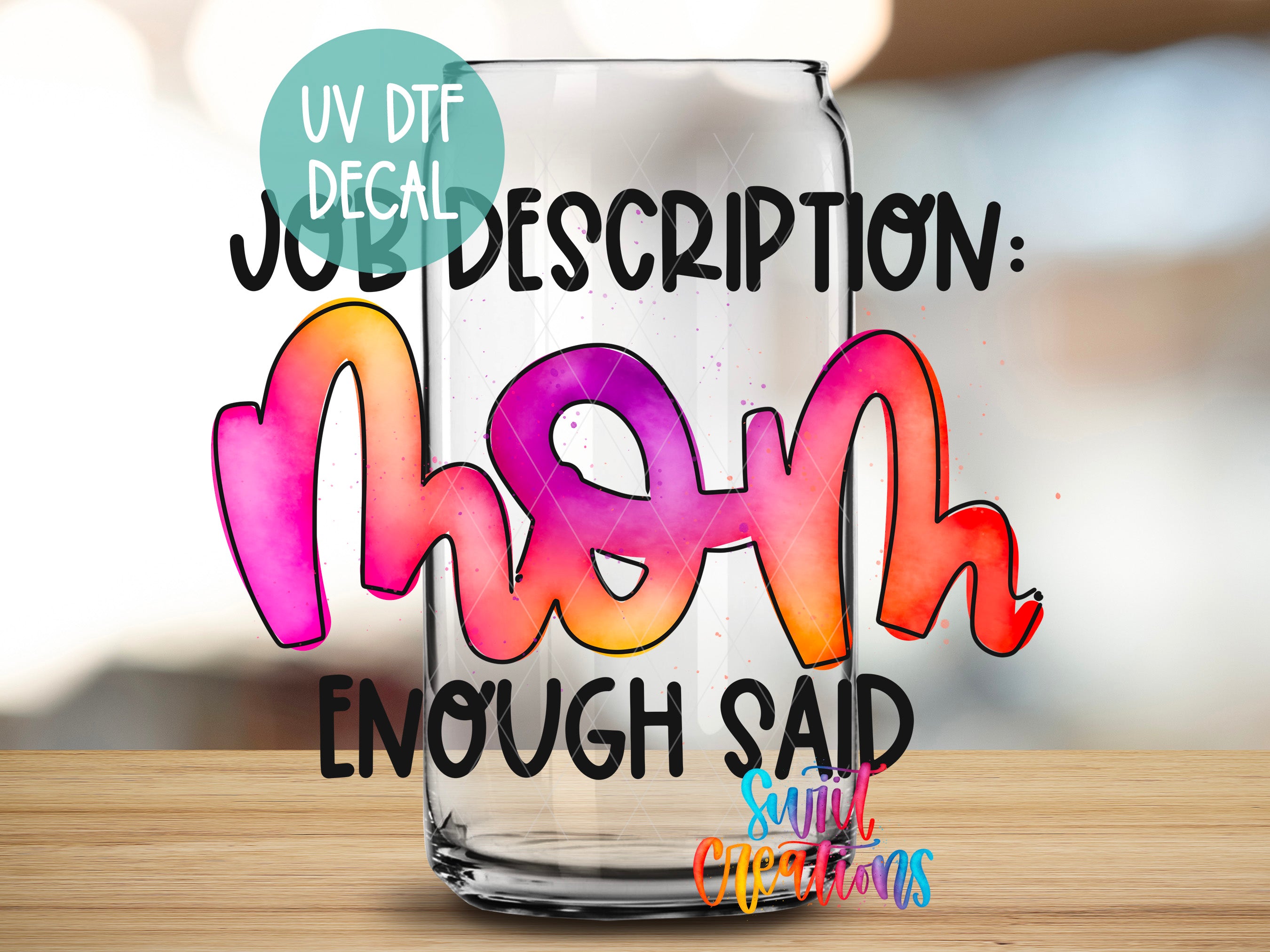 a glass filled with liquid sitting on top of a wooden table