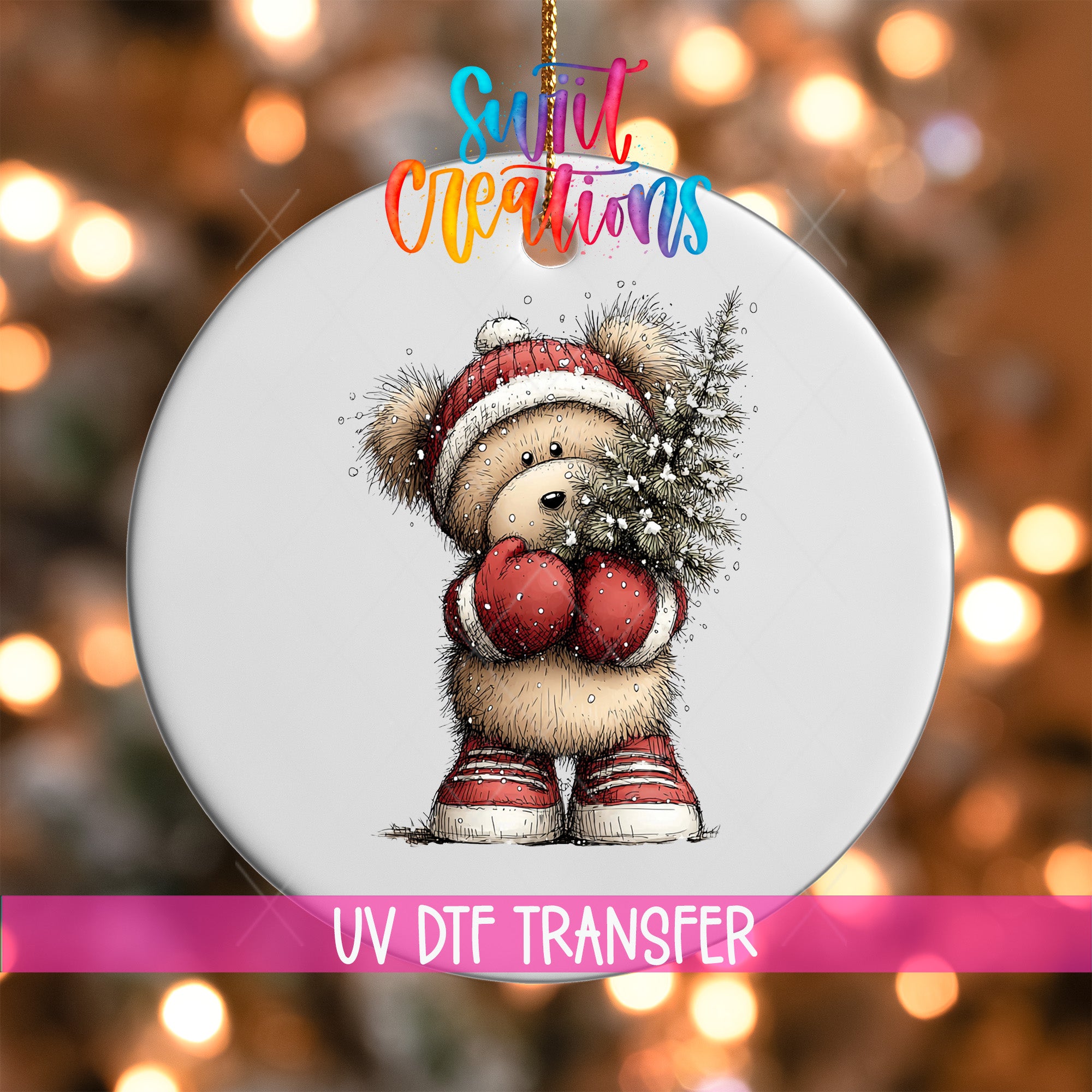 A white ornament with a teddy bear wearing a red hat and holding a Christmas tree.