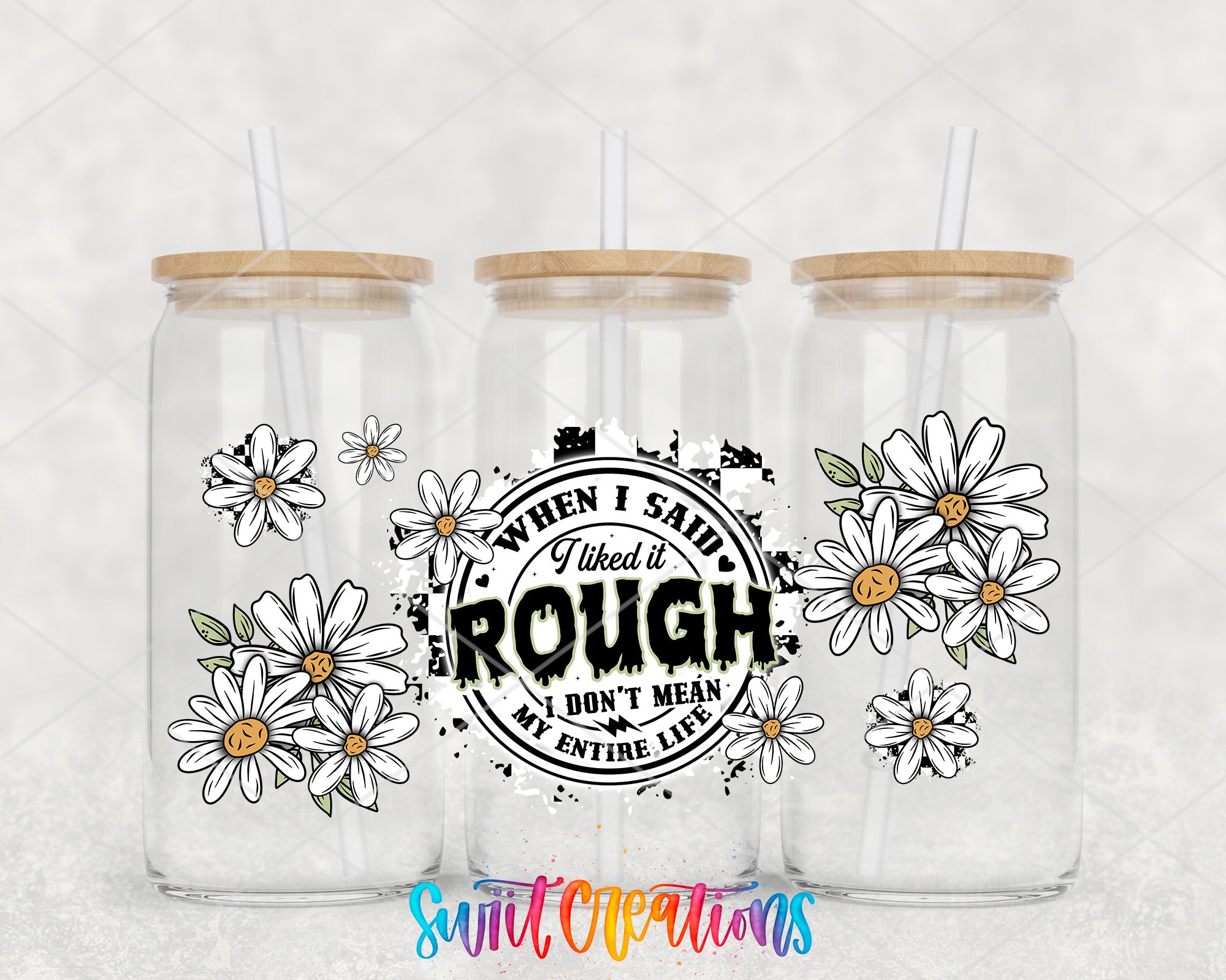 three clear glass jars with wooden lids, each adorned with a design of white daisies and the text "When I Said I Liked it, I Don't Mean My Entire Life" printed on them.