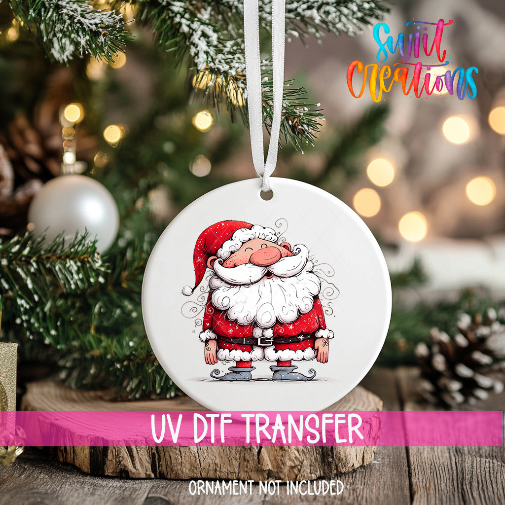 A white ornament with a Santa Claus illustration is hanging on a Christmas tree.