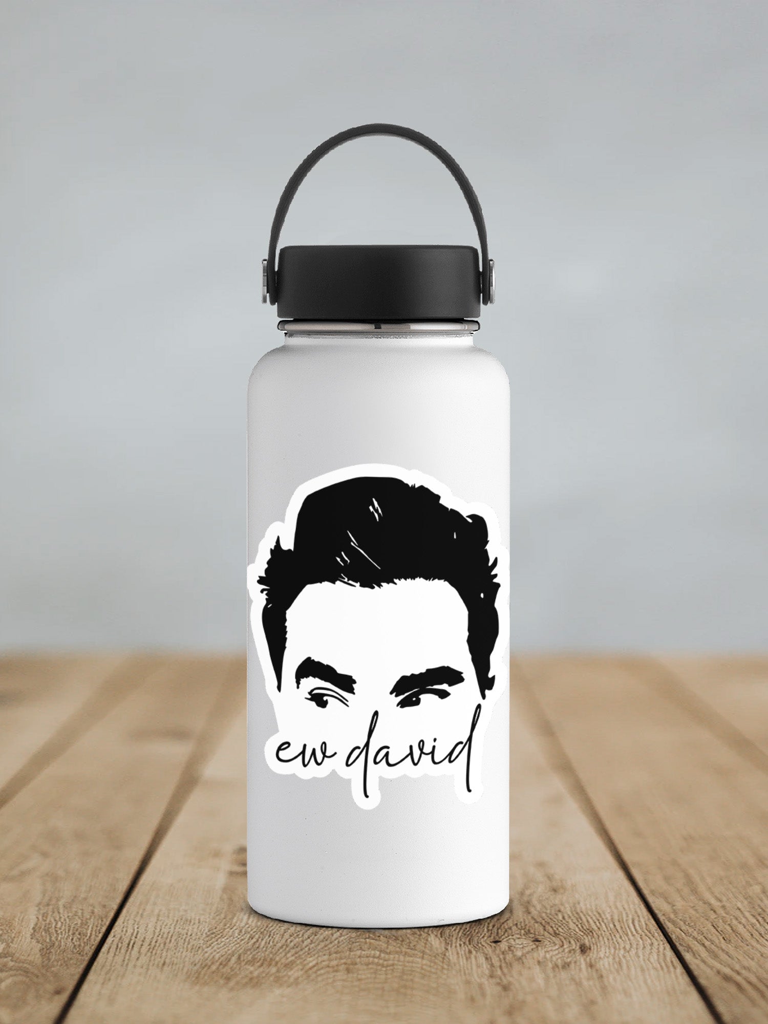 a water bottle with a picture of a man's face on it