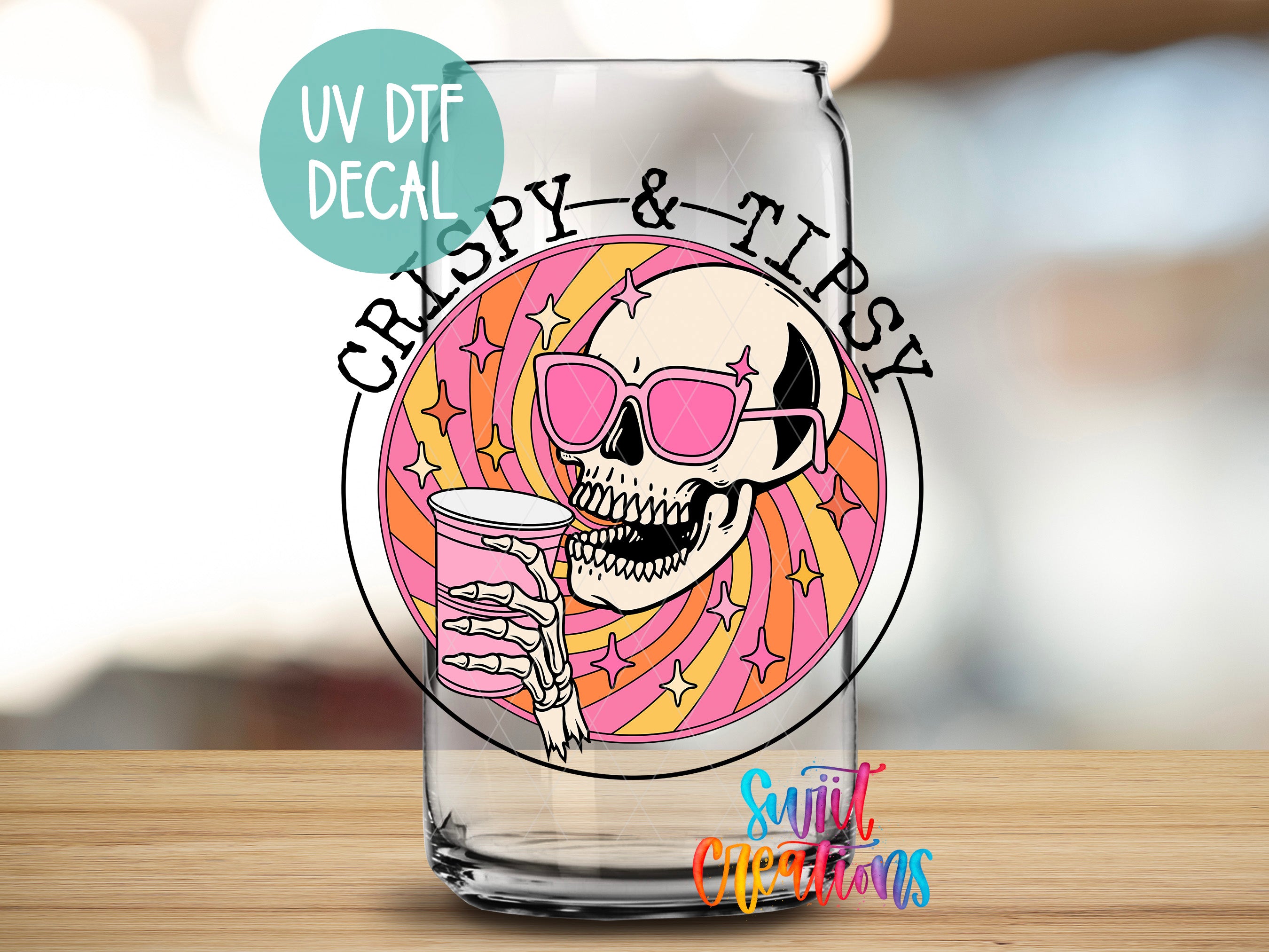 a glass with a skull and a drink in it