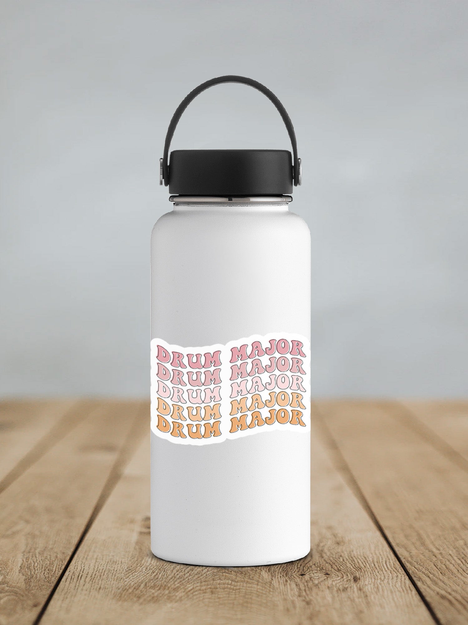 a white water bottle sitting on top of a wooden table