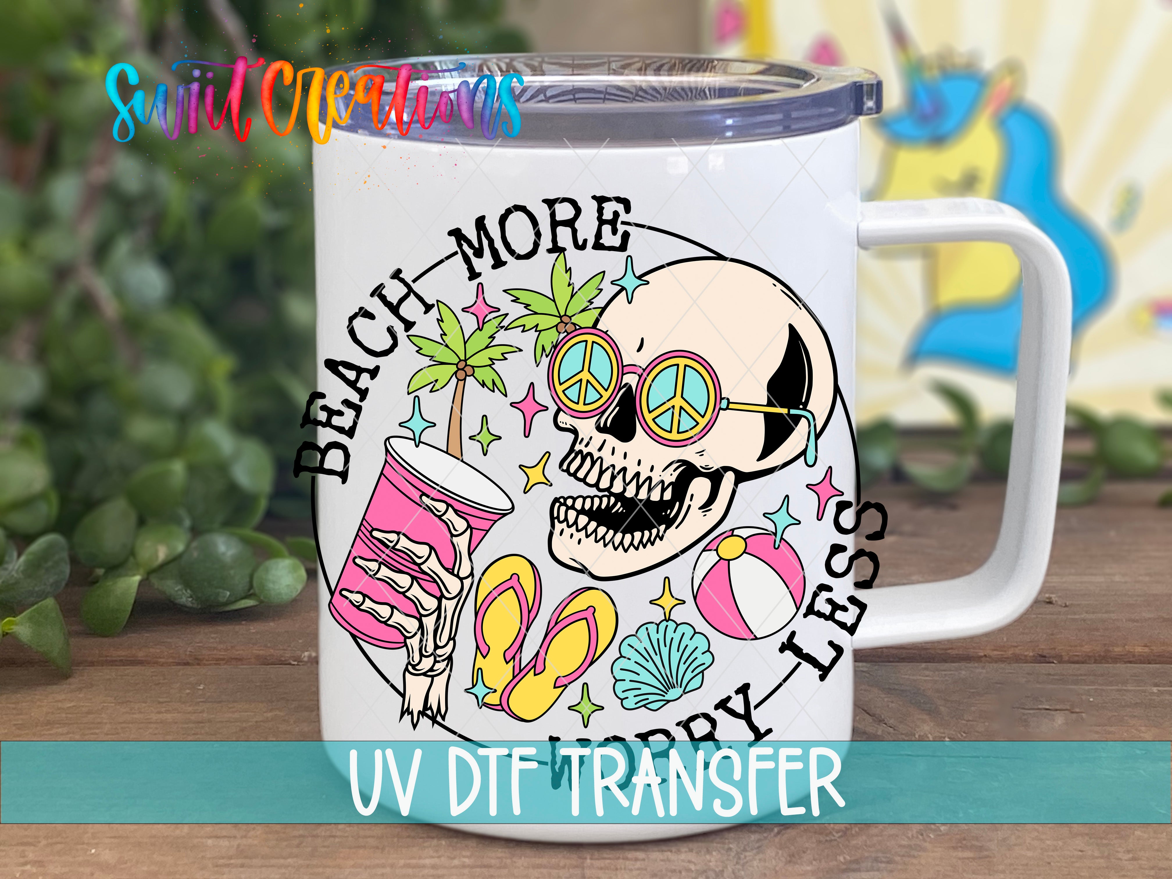 A white mug with a colorful design featuring a skull, sunglasses, beach-themed objects, and the text "BEACH MORE" and "LESS THAN 500 CHARACTERS".