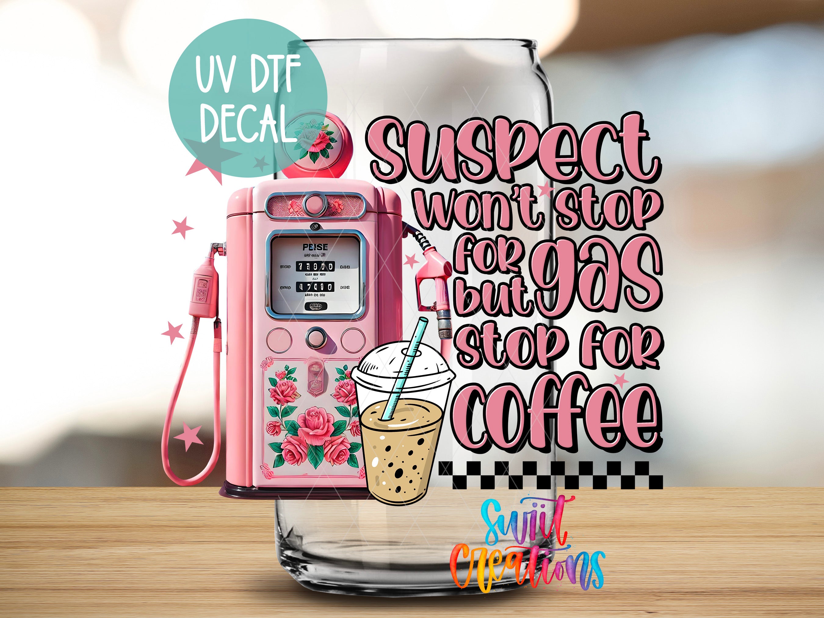 a pink phone sitting on top of a wooden table