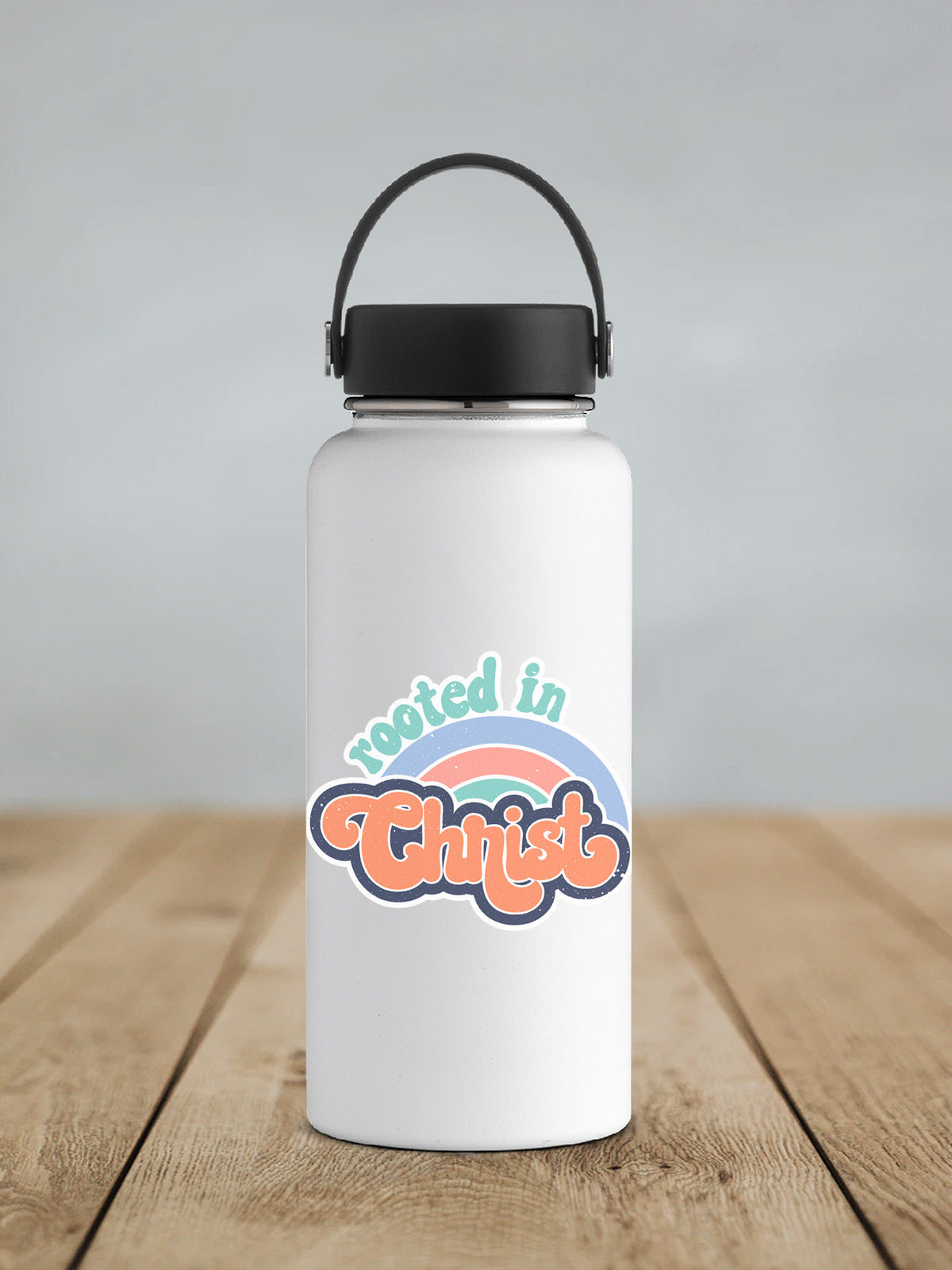 a white water bottle sitting on top of a wooden table