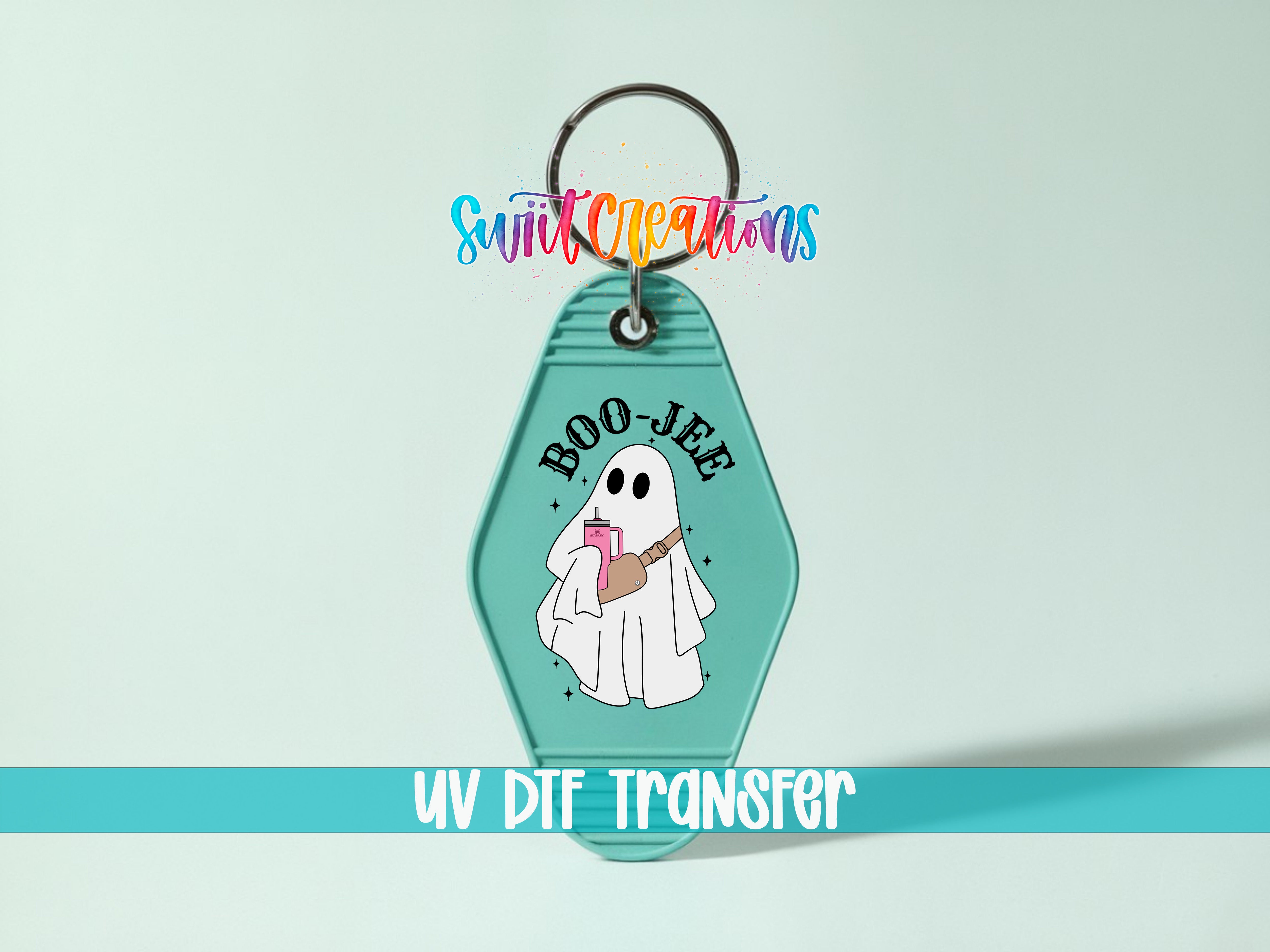 A keychain with a cartoon ghost holding a drink and the text "BOO-JEE" printed on it.