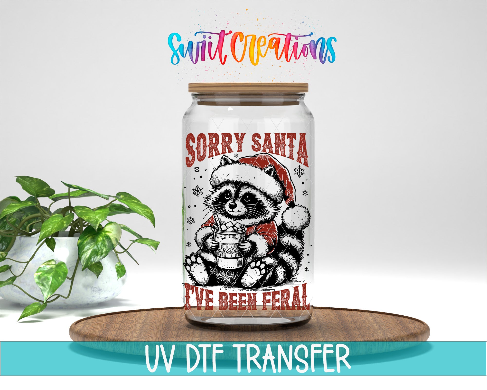 a glass jar with a raccoon wearing a Santa hat and holding a cup, along with the text "Sorry Santa I've Been Feral" printed on it.