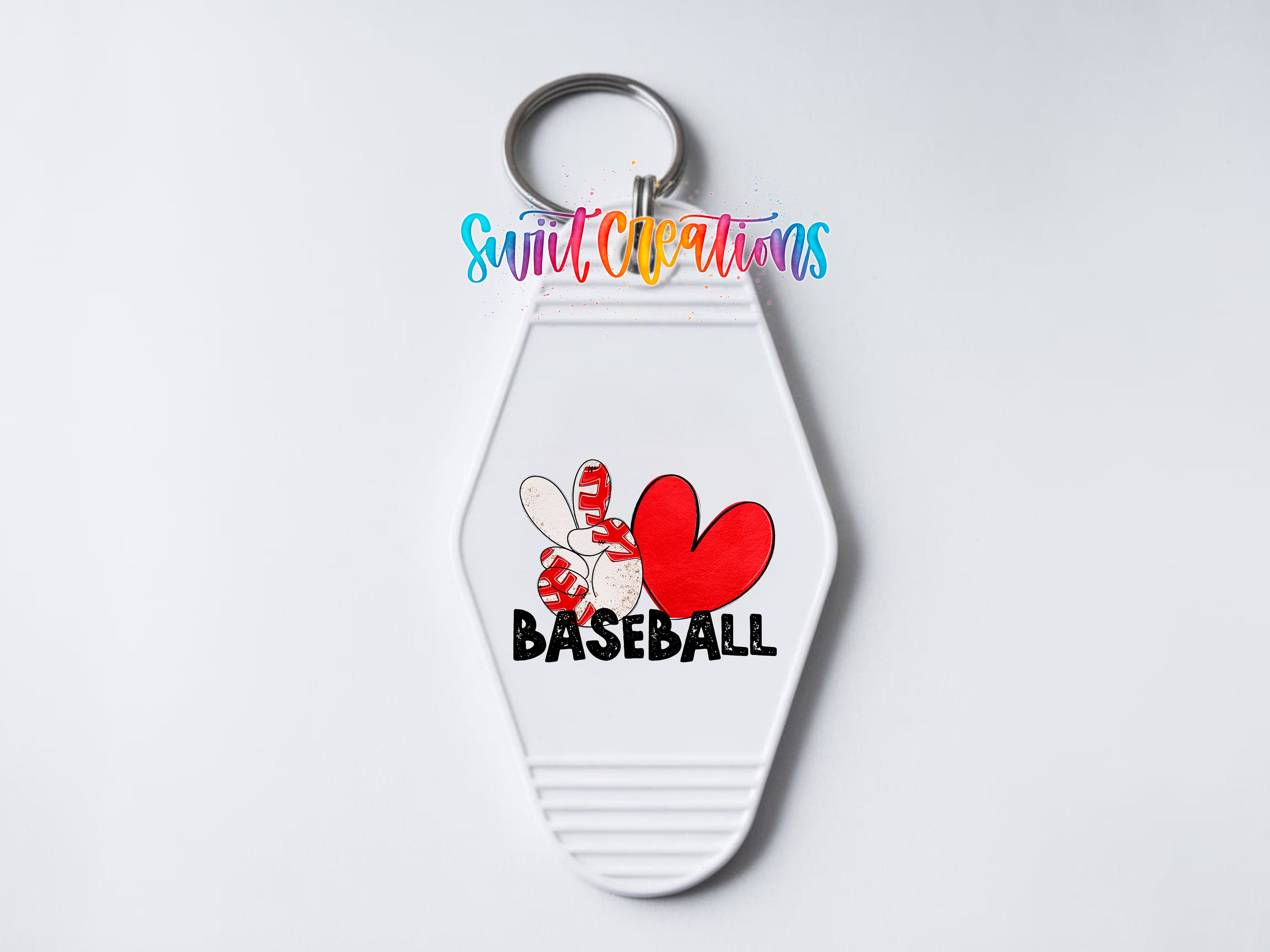 A white keychain with a baseball design and the word "BASEBALL" printed on it.