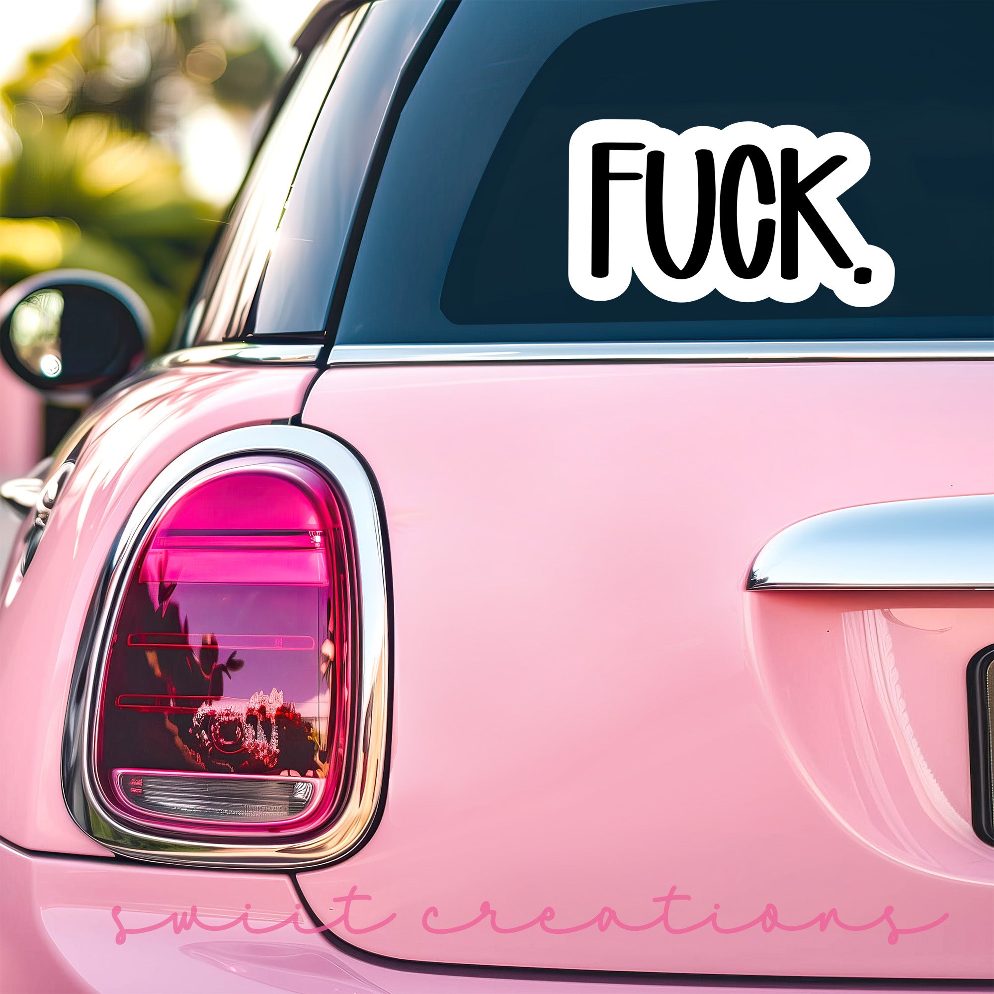 a pink car with a sticker that says fock