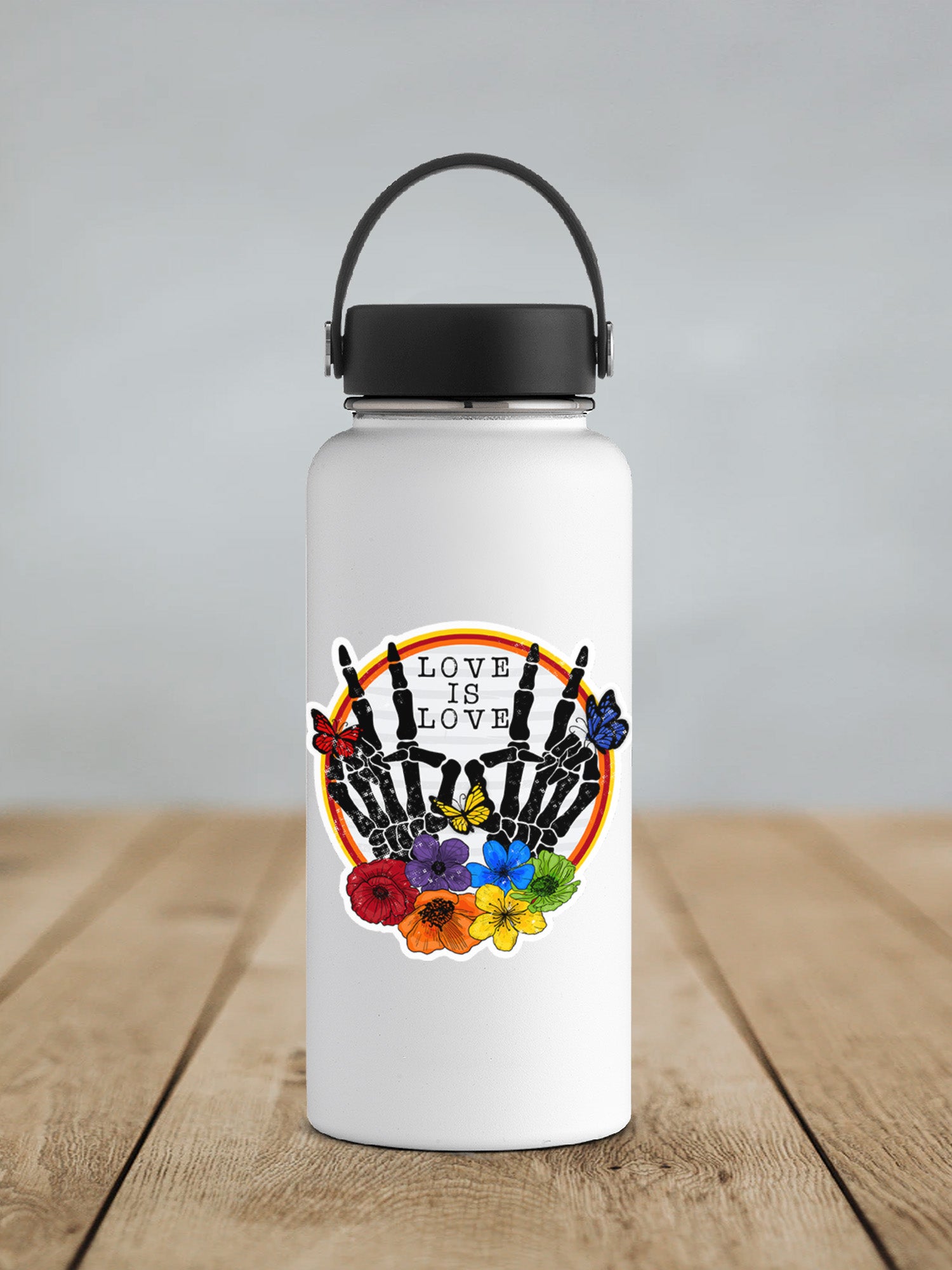 a white water bottle sitting on top of a wooden table