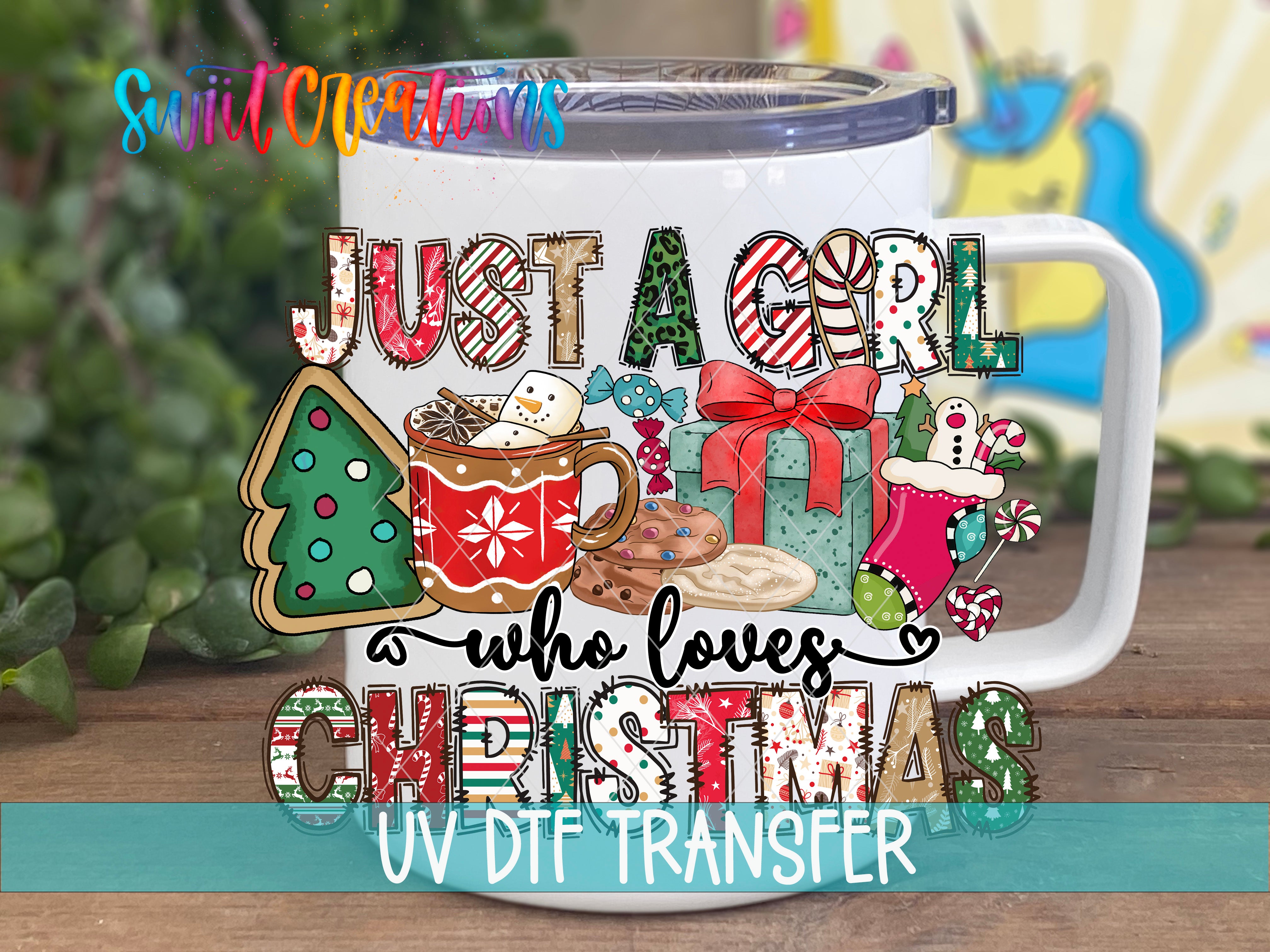 A white mug with a colorful, festive design featuring Christmas-themed items such as a Christmas tree, cookies, and stockings. The mug has a lid and a handle, and the text "Just a girl who loves Christmas" is displayed on it.