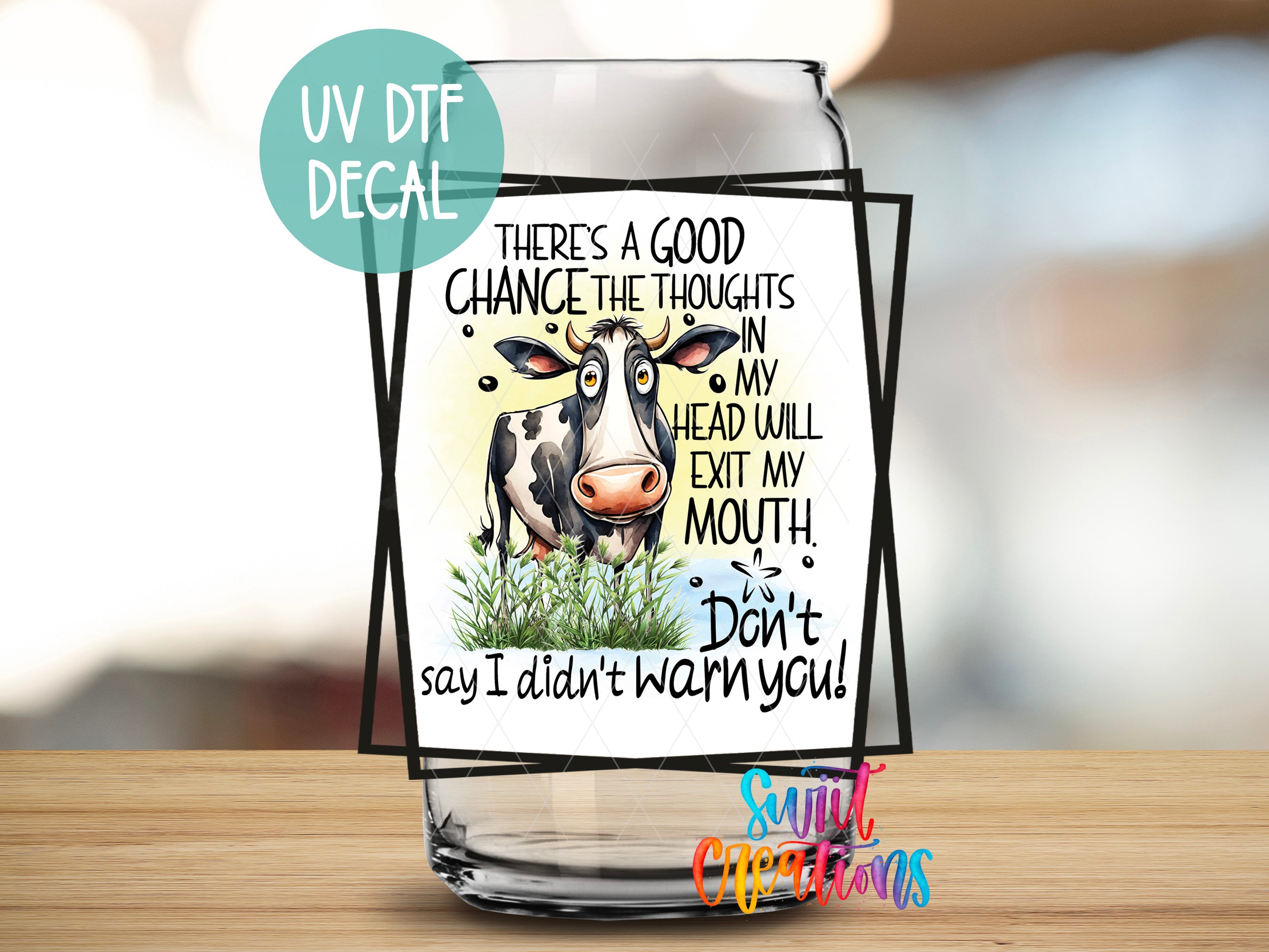 a glass with a picture of a cow on it