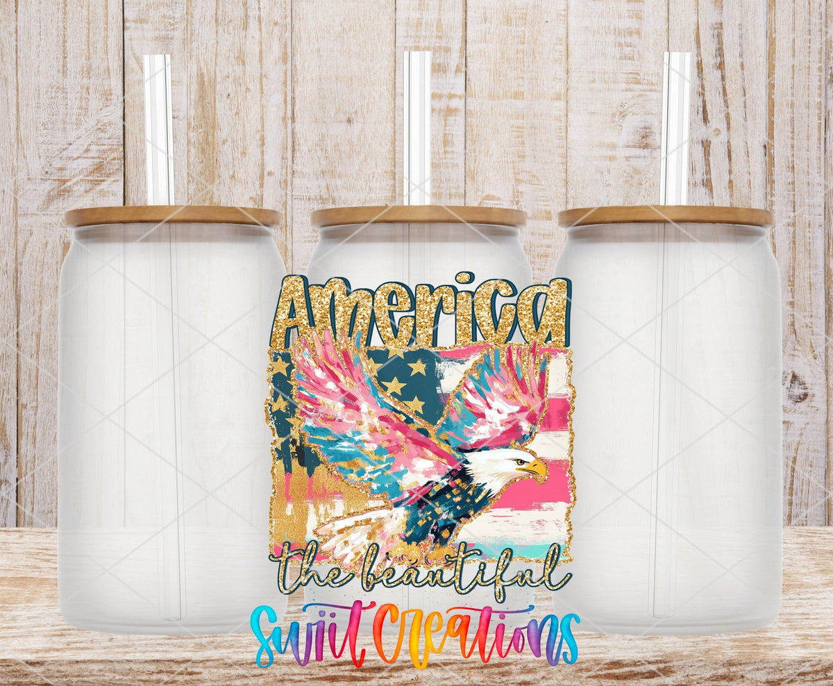 America The Beautiful Eagle Patriotic UV DTF transfer applied to a clear glass can set from Swiit Creations