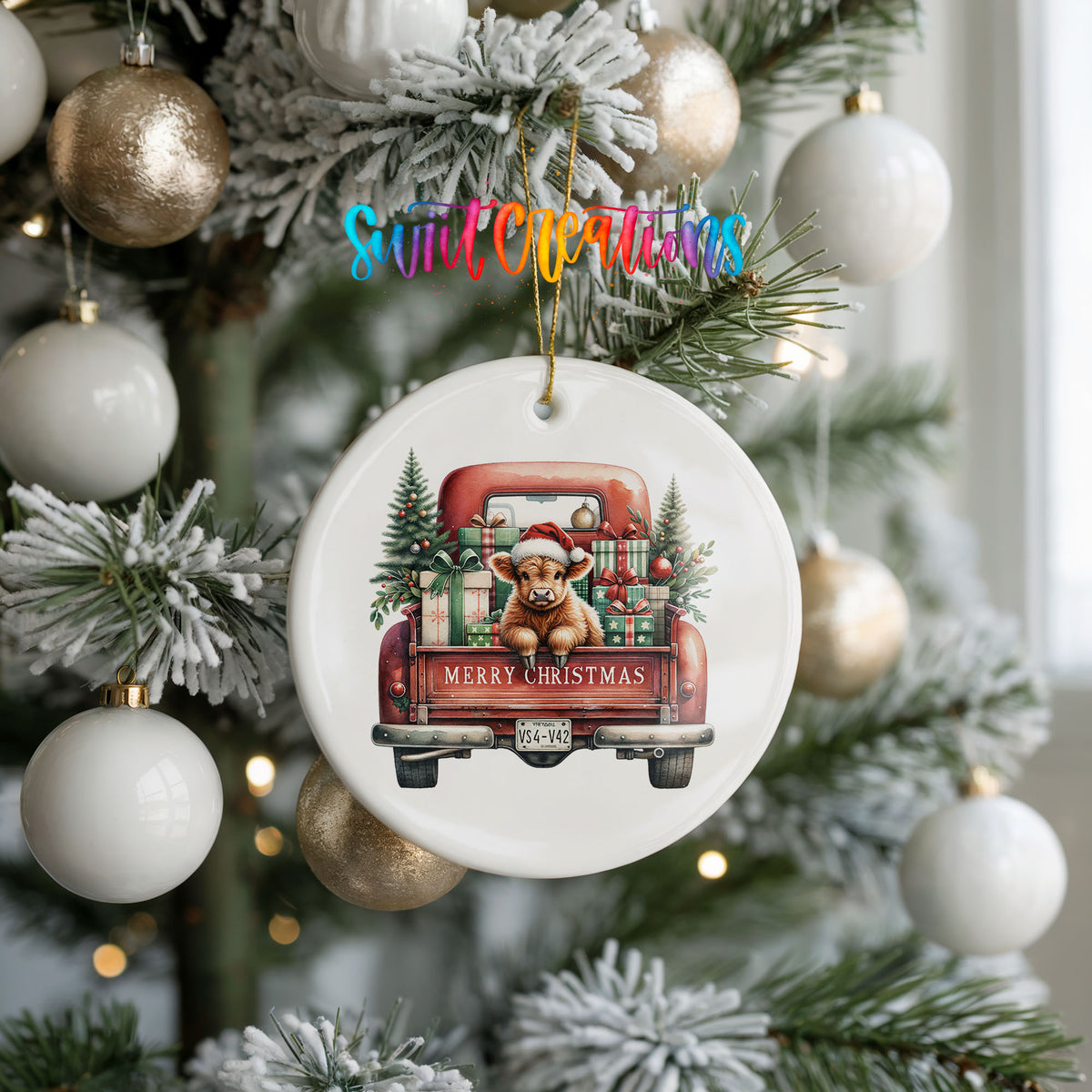A Christmas tree decorated with ornaments, including a ceramic ornament shaped like a truck carrying a teddy bear and presents.