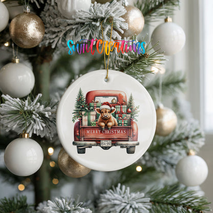 A Christmas tree decorated with ornaments, including a ceramic ornament shaped like a truck carrying a teddy bear and presents.