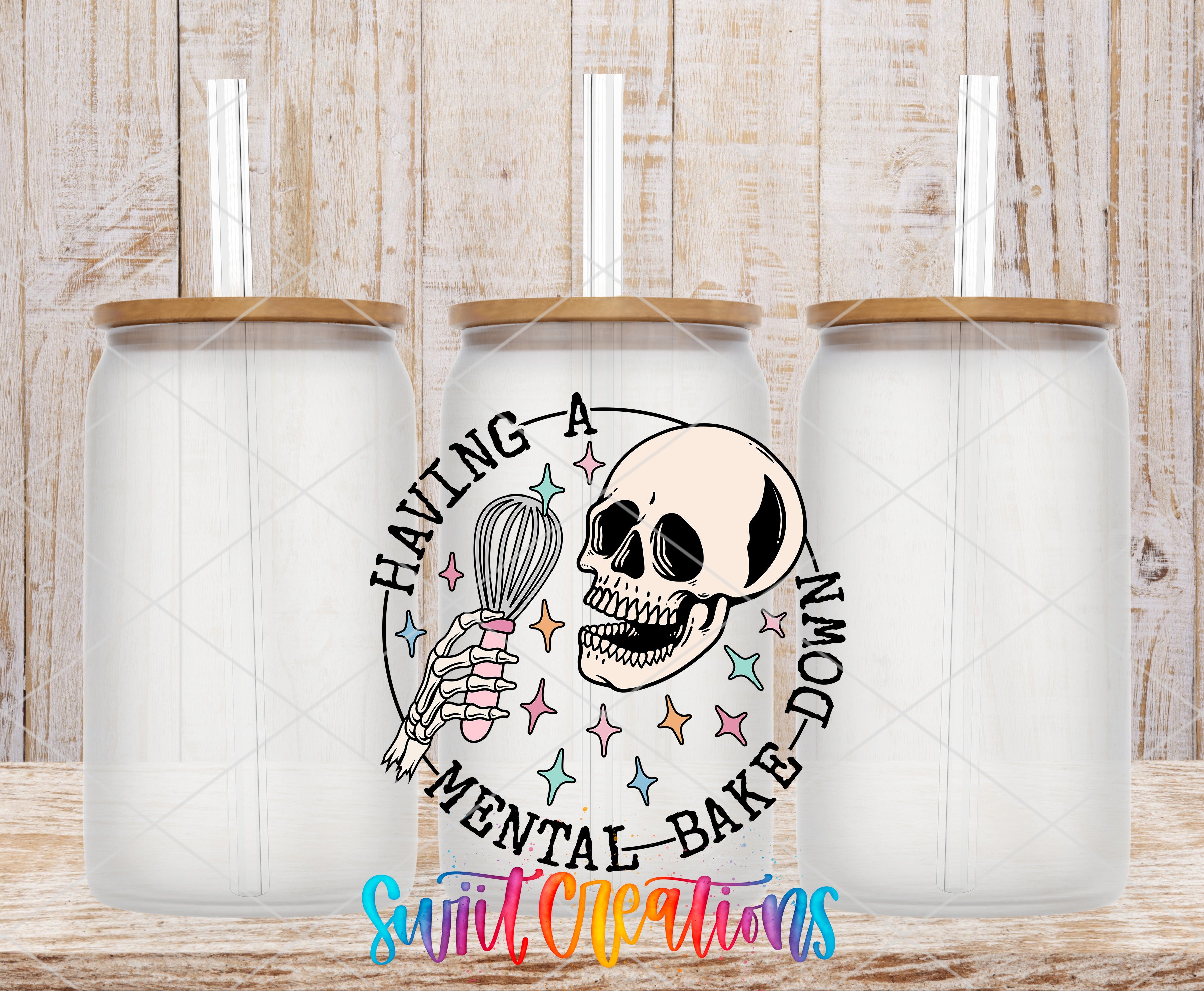 three glass jars with lids, each containing a straw, and a central design that includes a skull holding a whisk and surrounded by colorful stars.