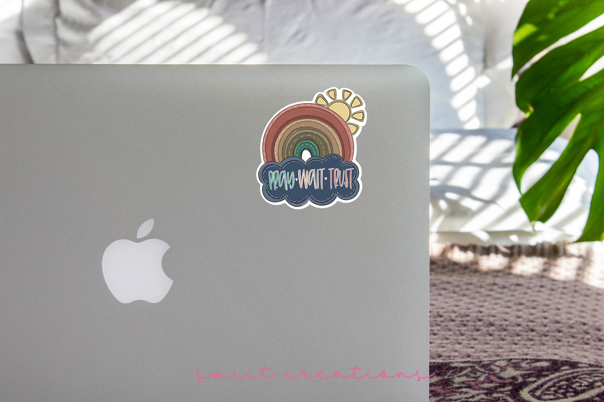 a laptop with a rainbow sticker on it