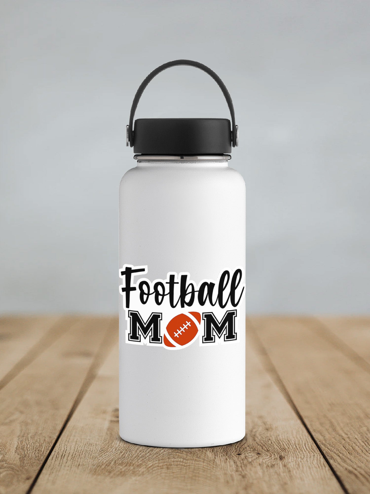 a white water bottle with a football mom on it