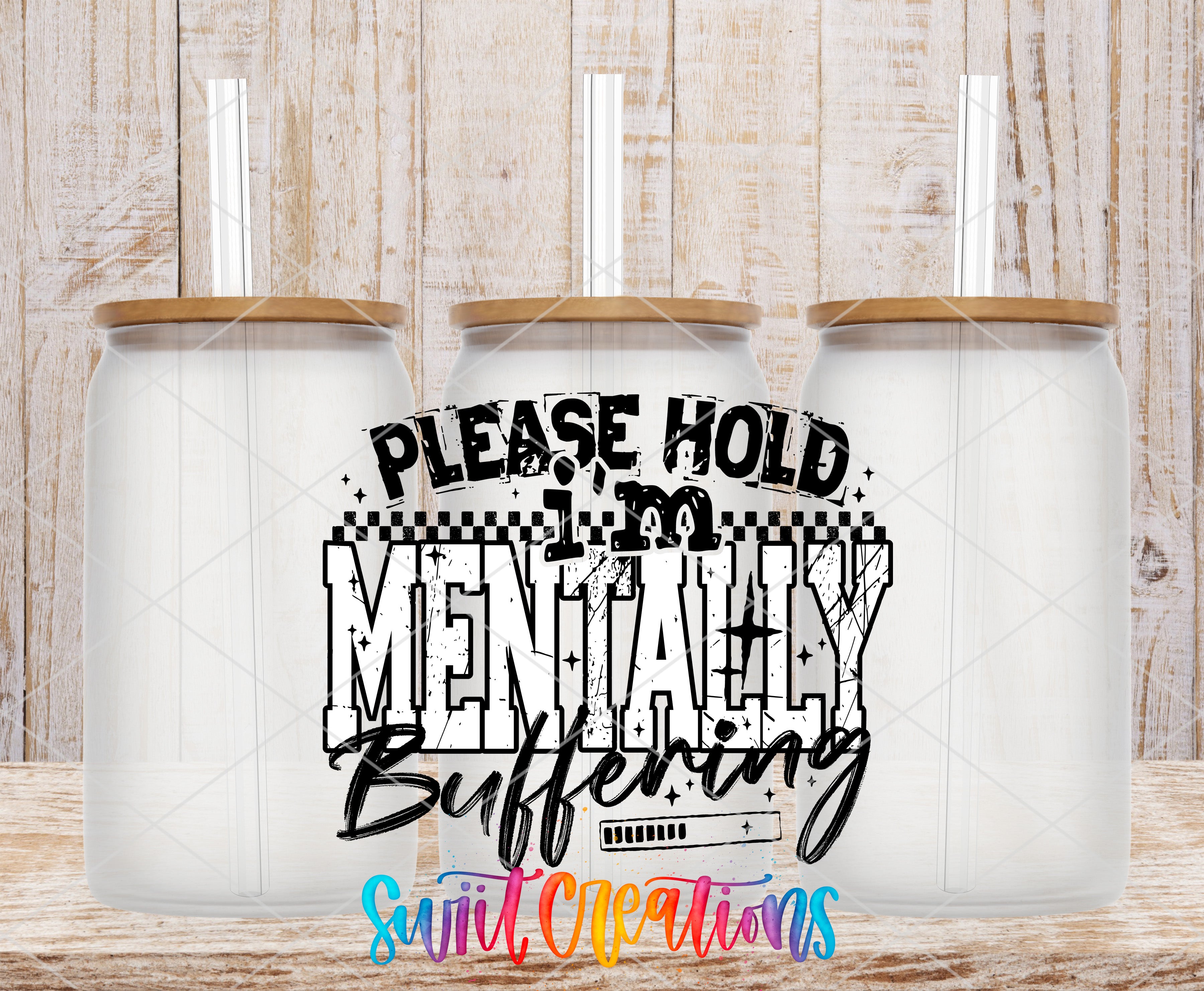 three transparent glass jars with wooden lids, arranged in a row against a wooden background. The jars have straws sticking out of the tops. The image also contains a text overlay that reads "PLEASE HOLD MENTALLY Buffering" in a stylized font, with a colorful rainbow-colored text element at the bottom.