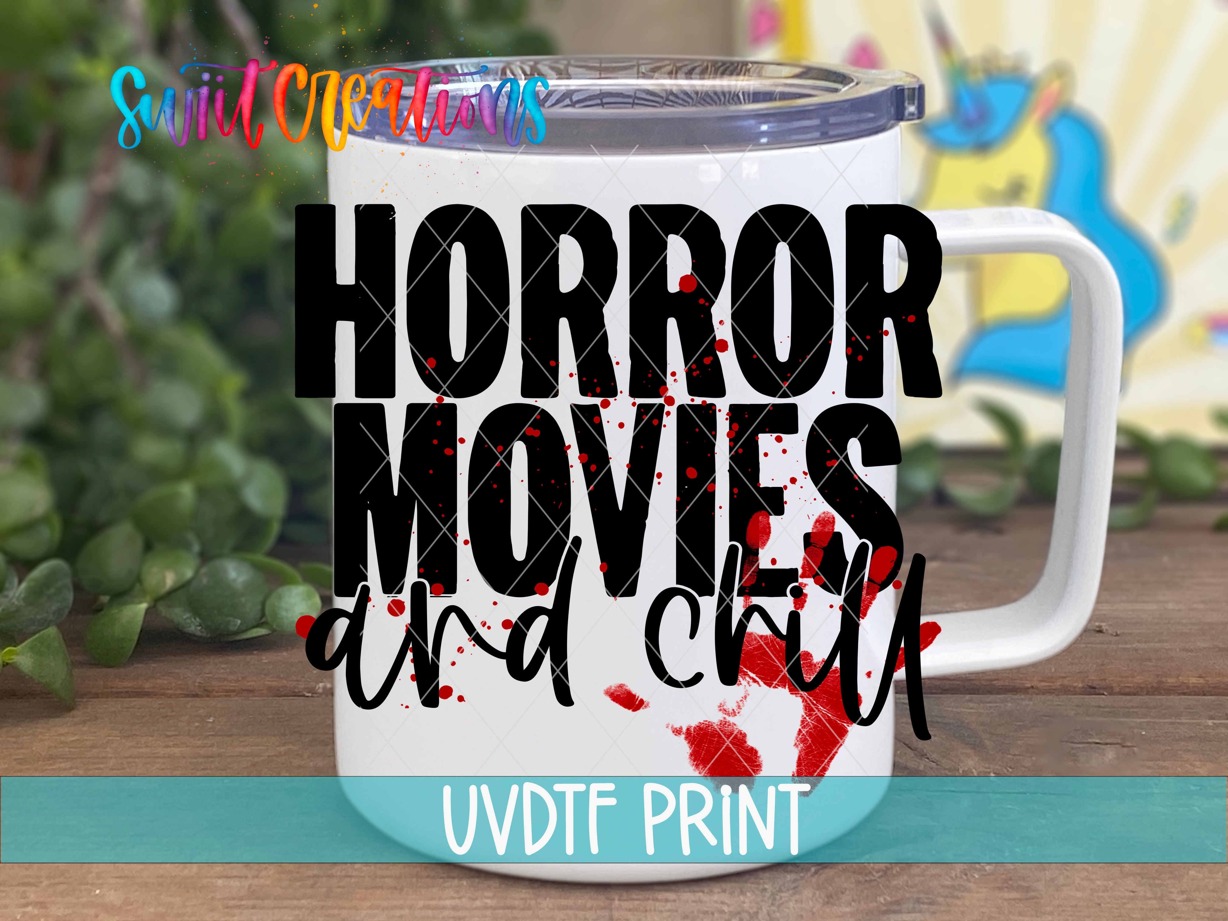 A white mug with the text "HORROR MOVIES and chill" printed on it, along with a graphic of a unicorn.