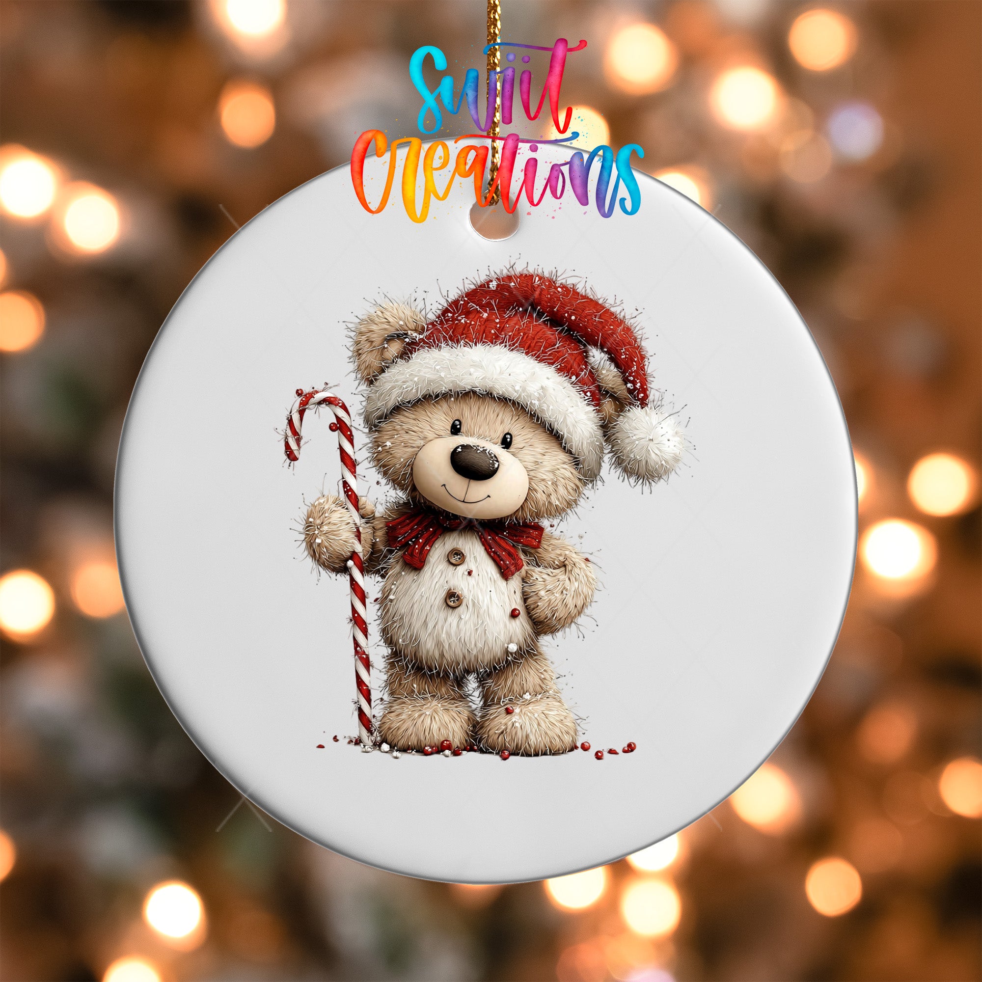 A white ornament featuring a teddy bear wearing a Santa hat and holding a candy cane, with a colorful text overlay that reads "Sweet Creations".