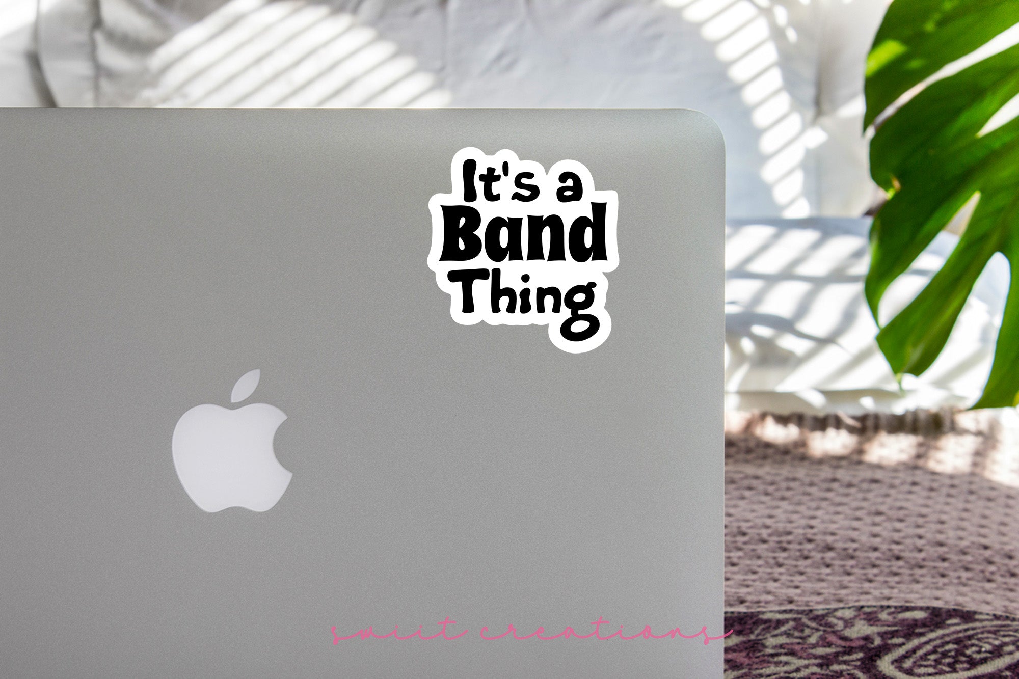 a laptop with a sticker that says it's a band thing