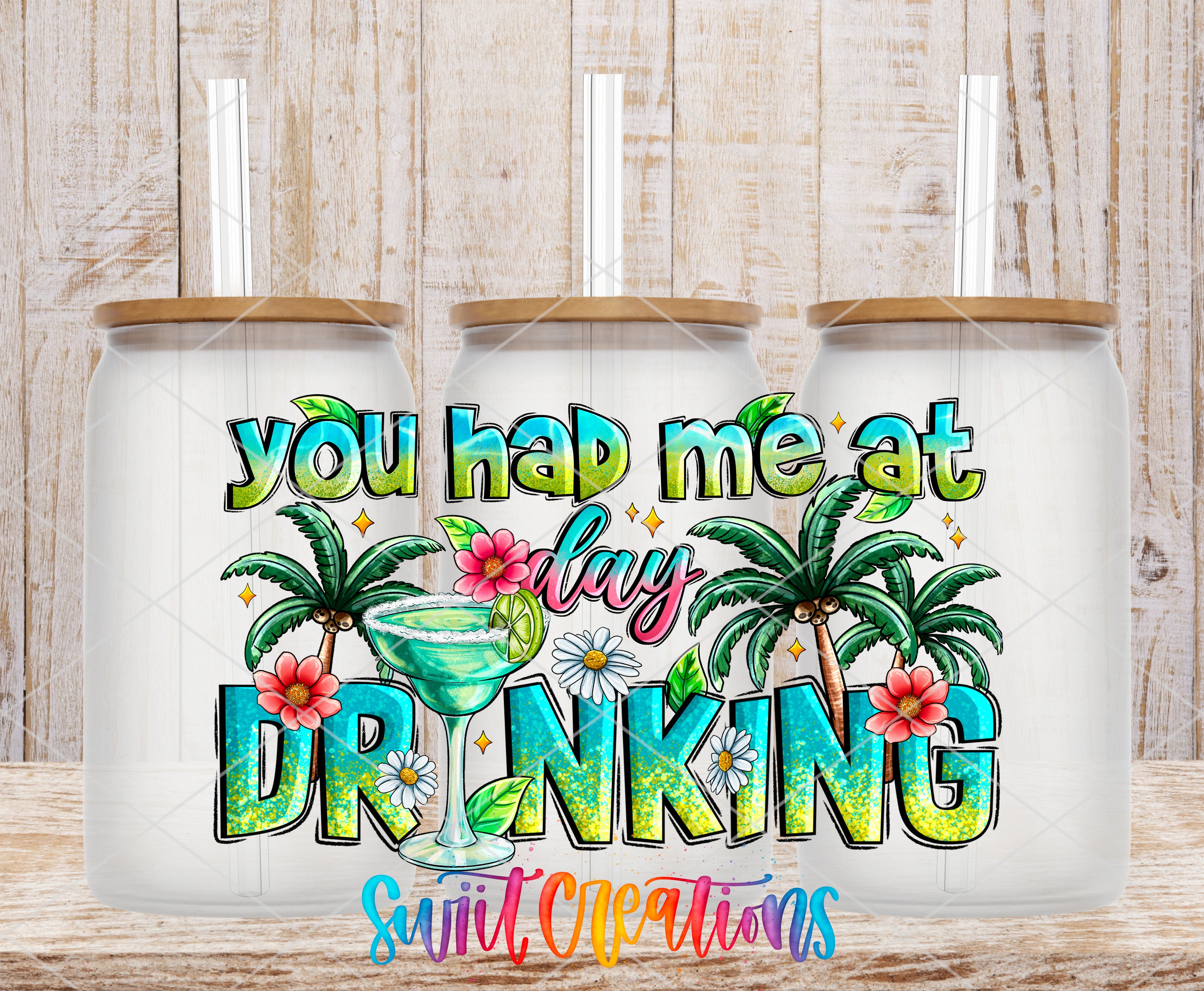 A colorful t-shirt design featuring a tropical drink with palm trees and flowers, along with the text "you had me at drinking" in a playful and humorous manner.