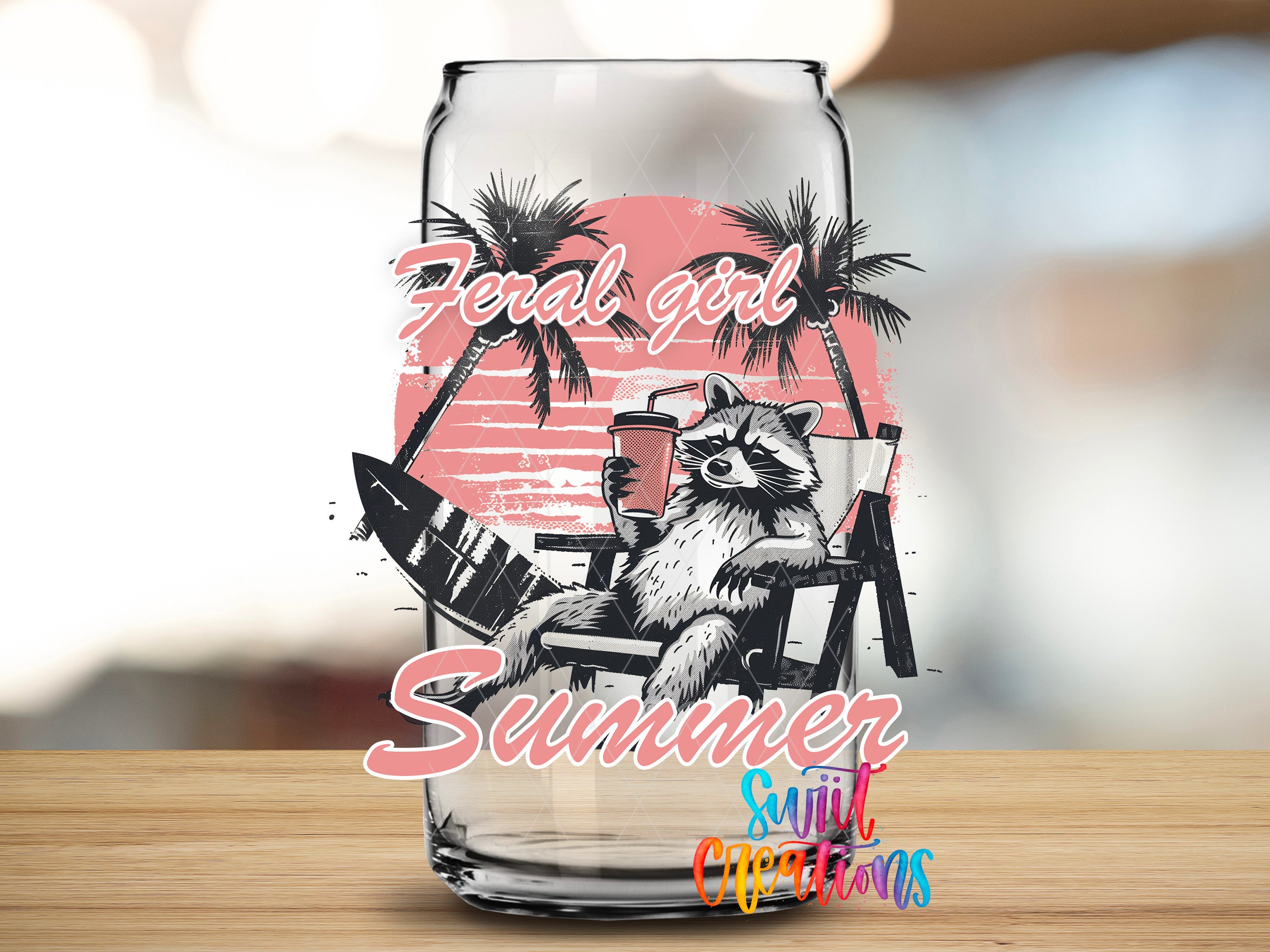 A glass can with a graphic design featuring a raccoon sitting on a beach chair, a surfboard, and palm trees, along with the text "Feral girl summer" and "Suitcase decorations".