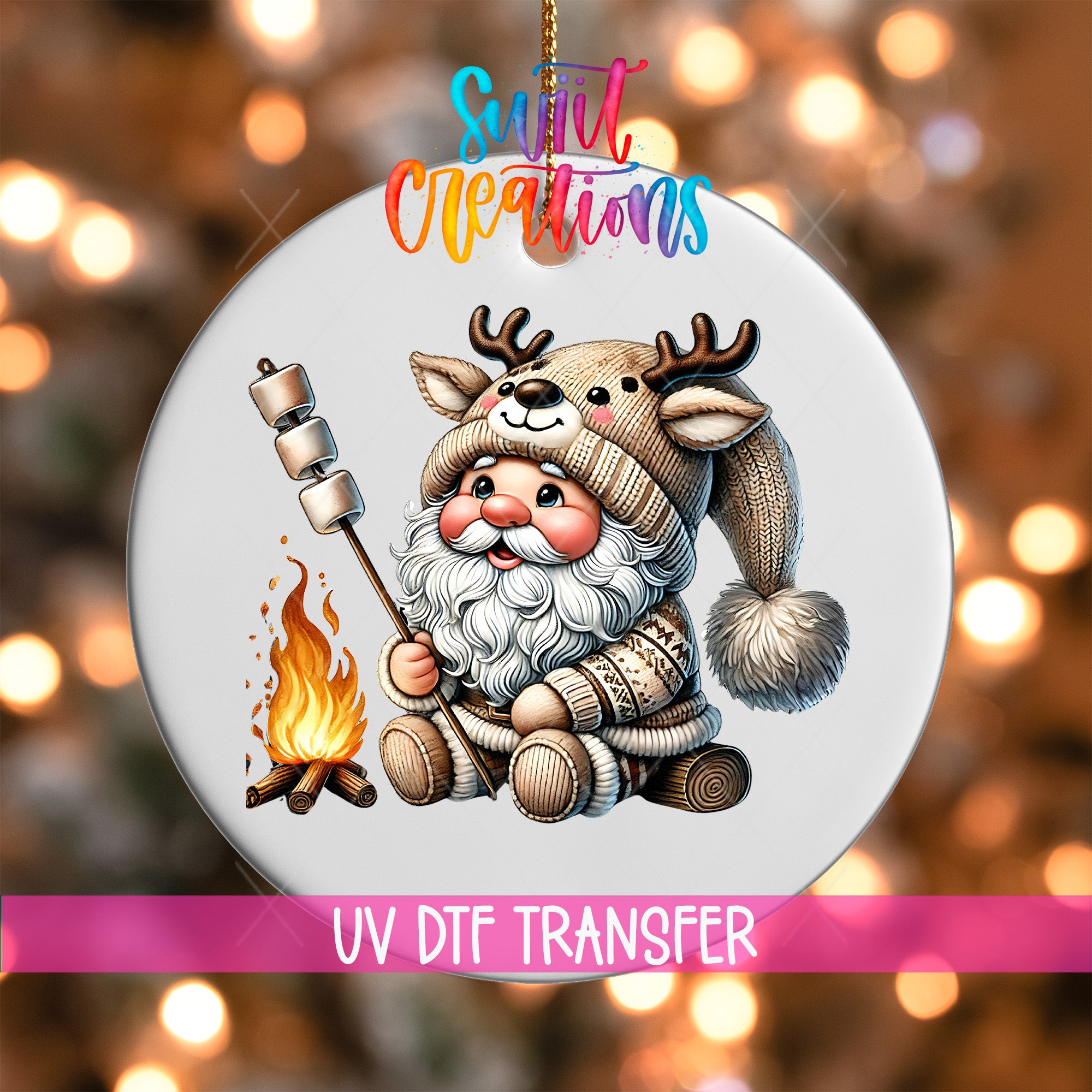 A white ornament featuring a cartoon Santa Claus character wearing a hat with antlers, holding a marshmallow over a campfire.