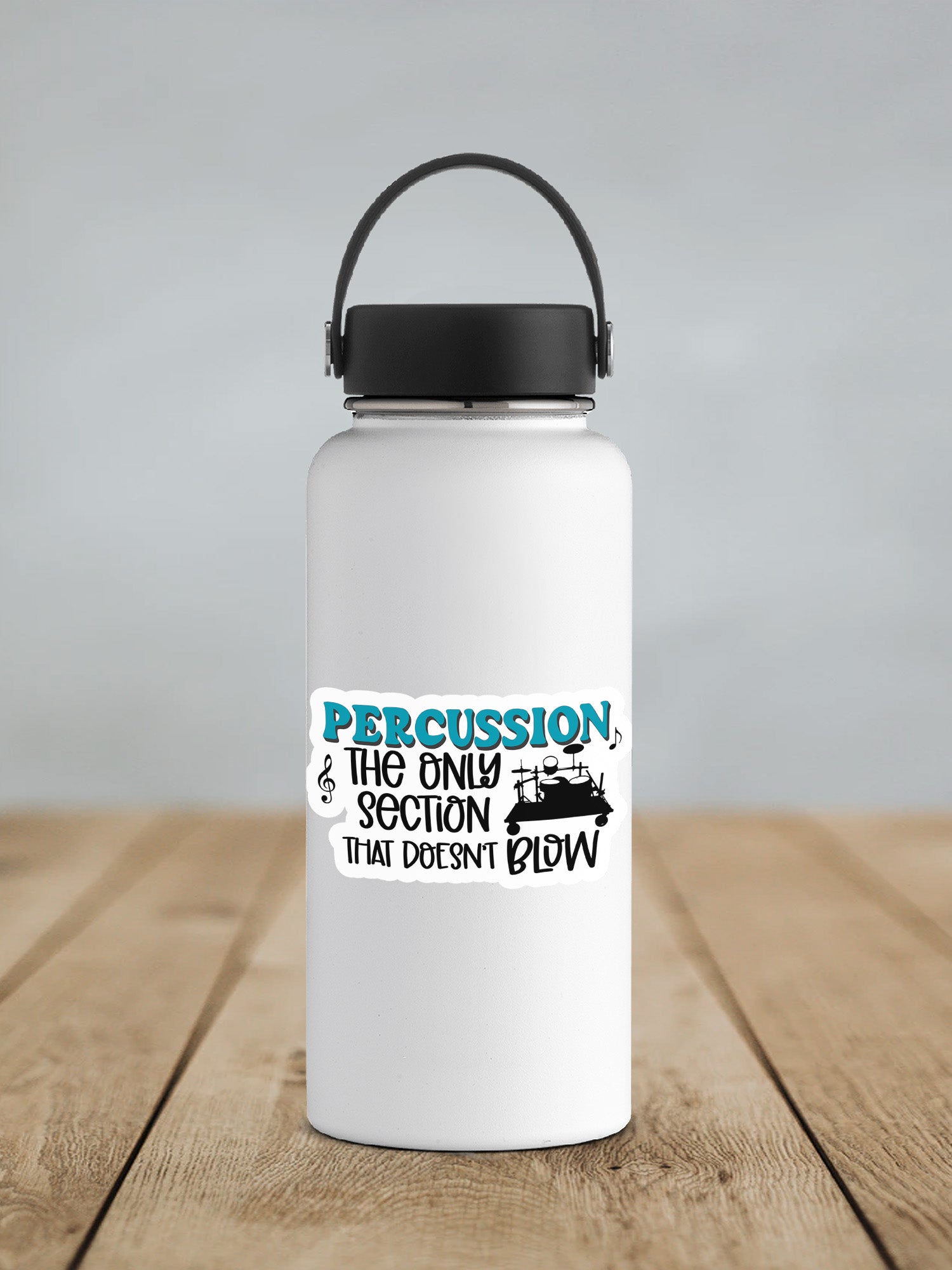 a white water bottle sitting on top of a wooden table