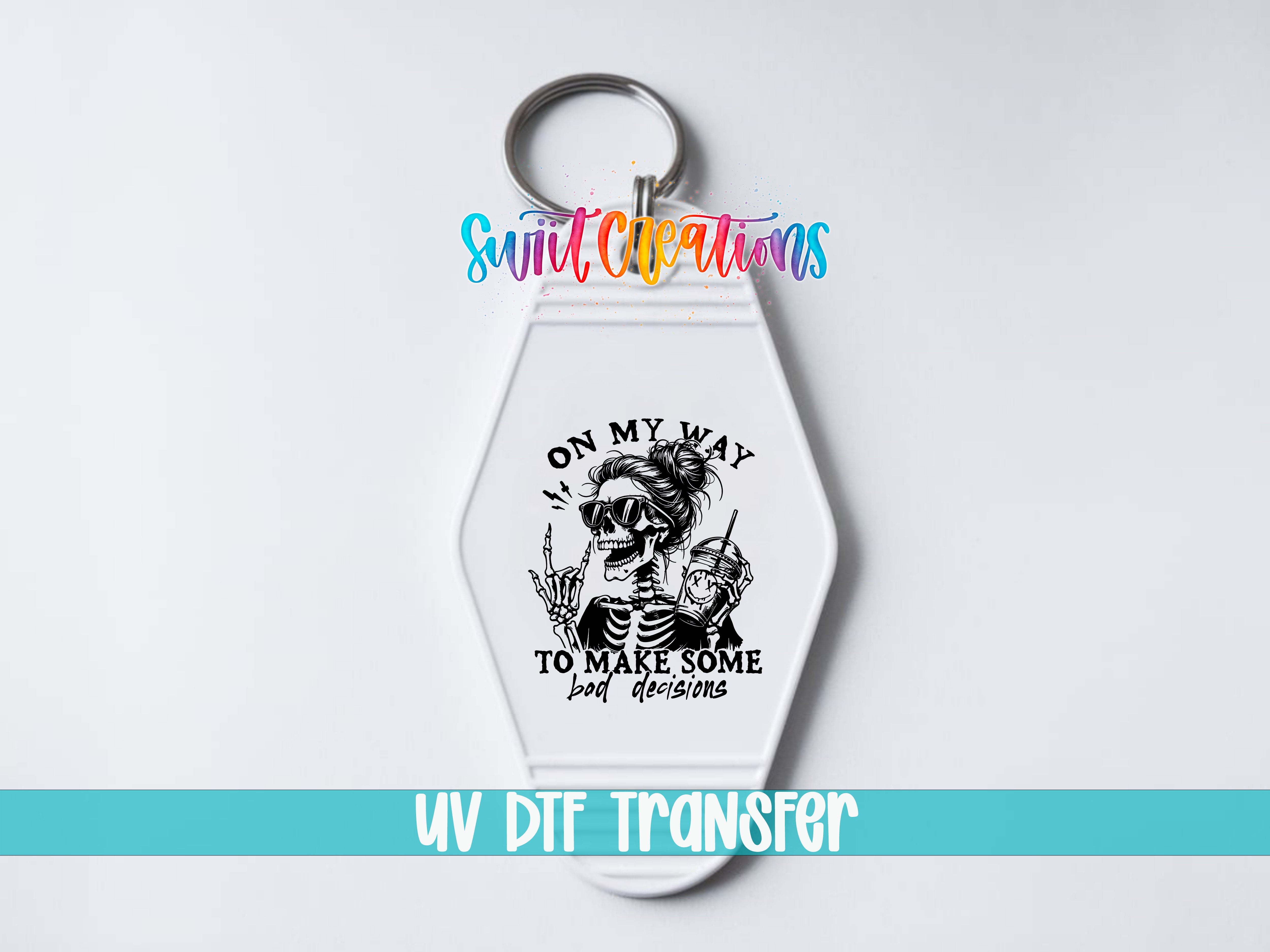 A keychain with a skull design and text that says "ON MY WAY TO MAKE SOME BAD DECISIONS" and "UV DIF TRANSFER".