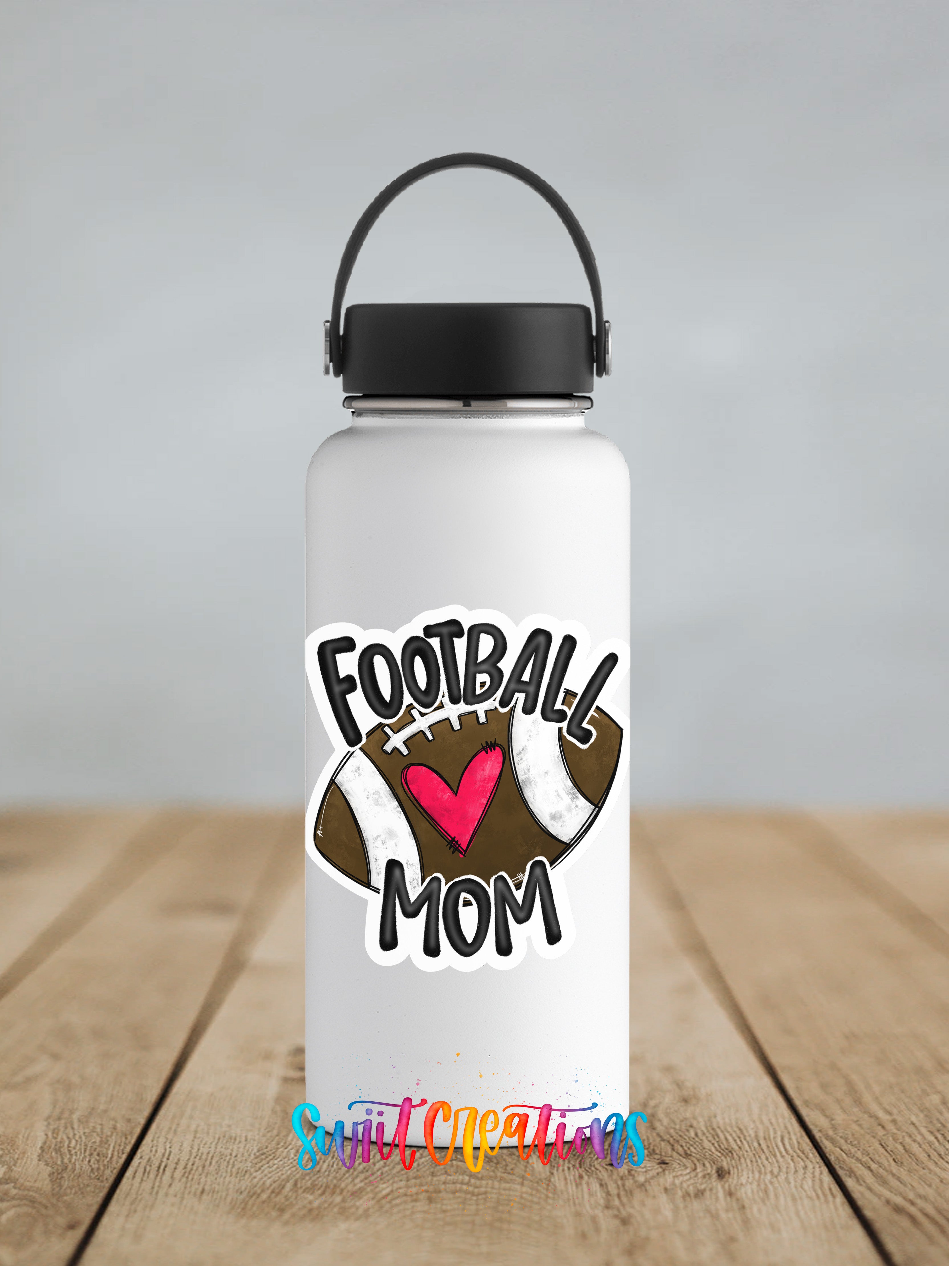 A white water bottle with a black handle and a sticker that says "Football Mom" and features a football with a heart.