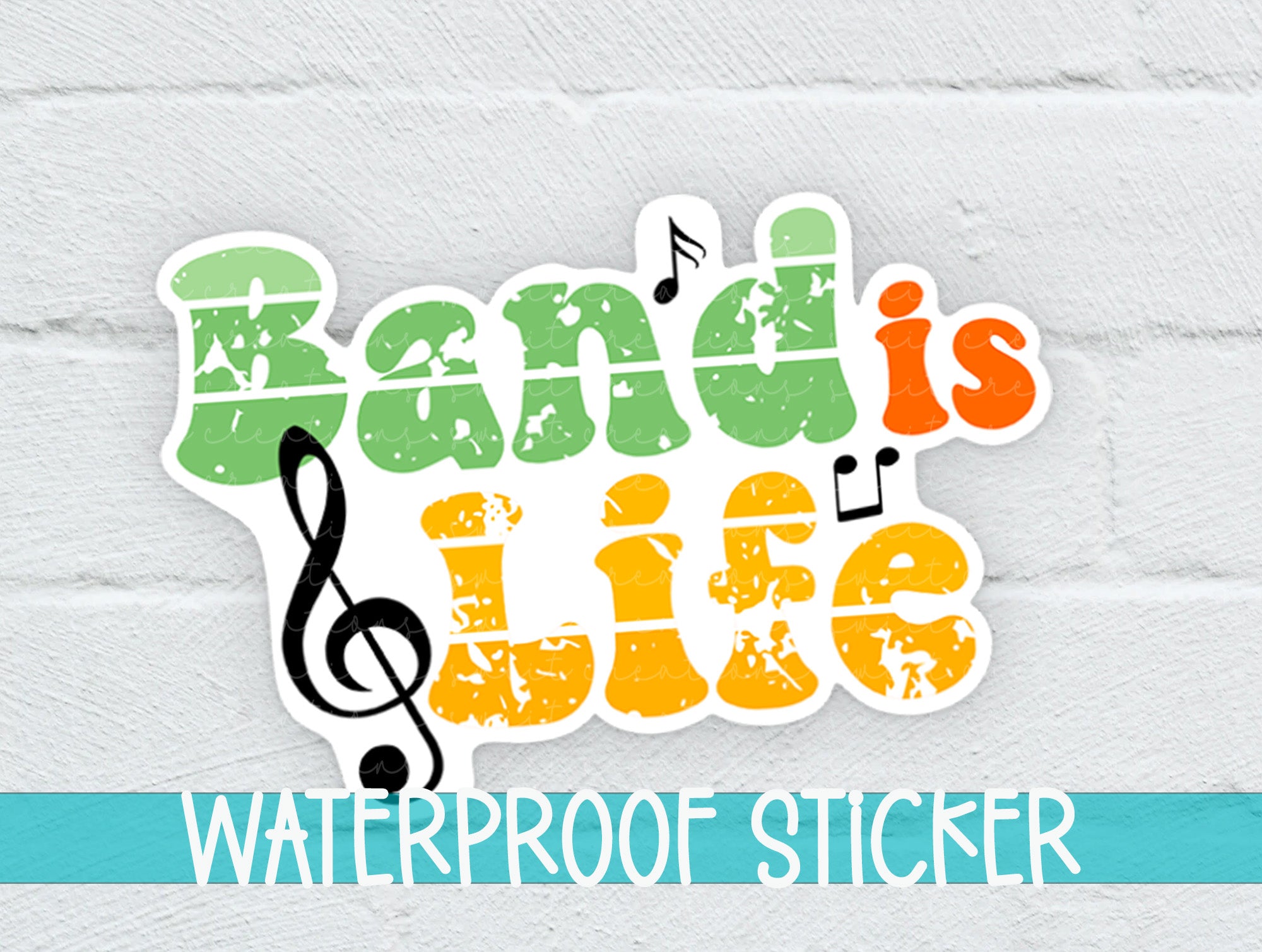 a white brick wall with a colorful sticker that says band is life