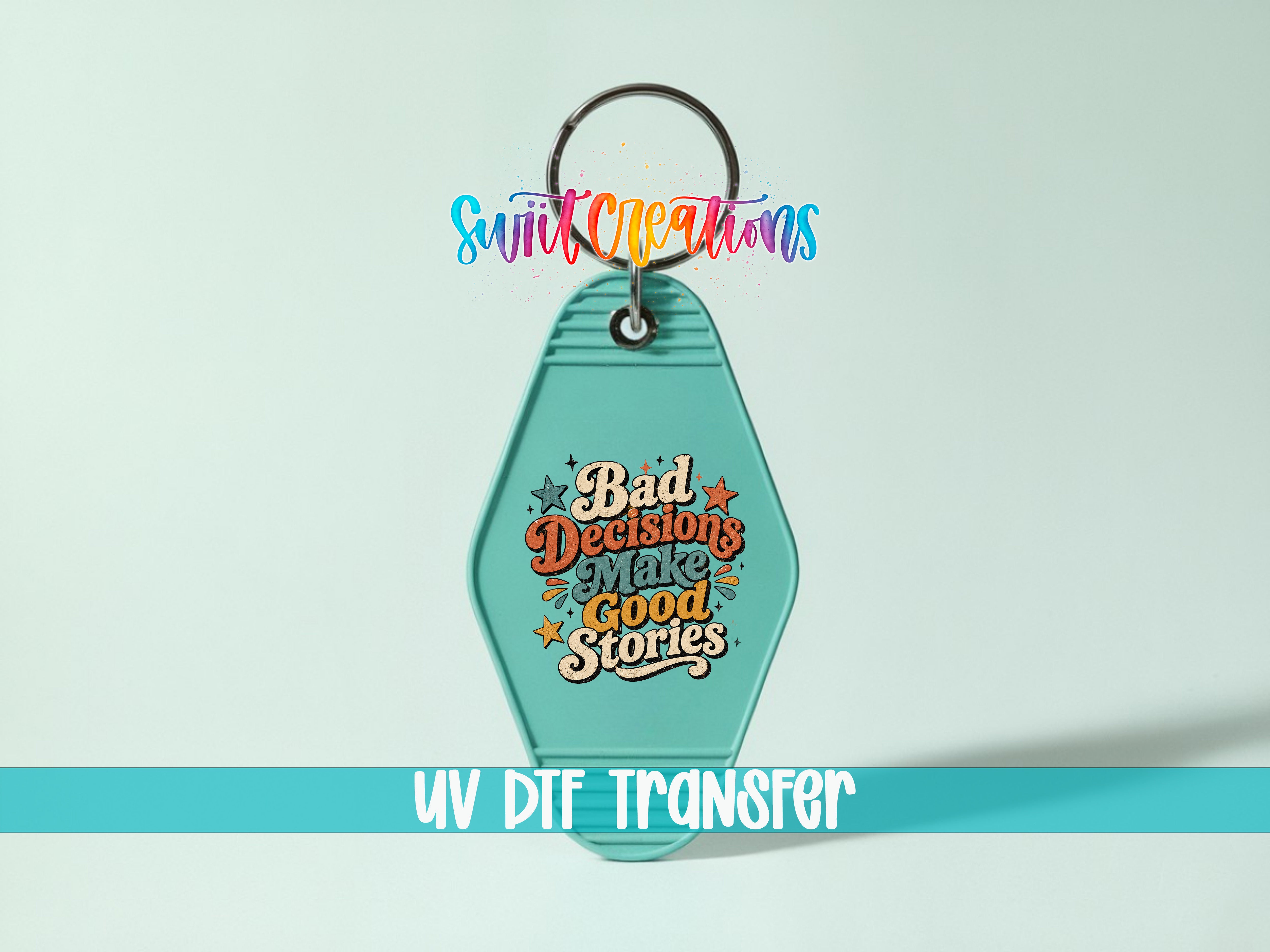 A keychain with a colorful design and text, including the phrase "Bad Decisions Make Good Stories" and the UV DIF Transfer logo.