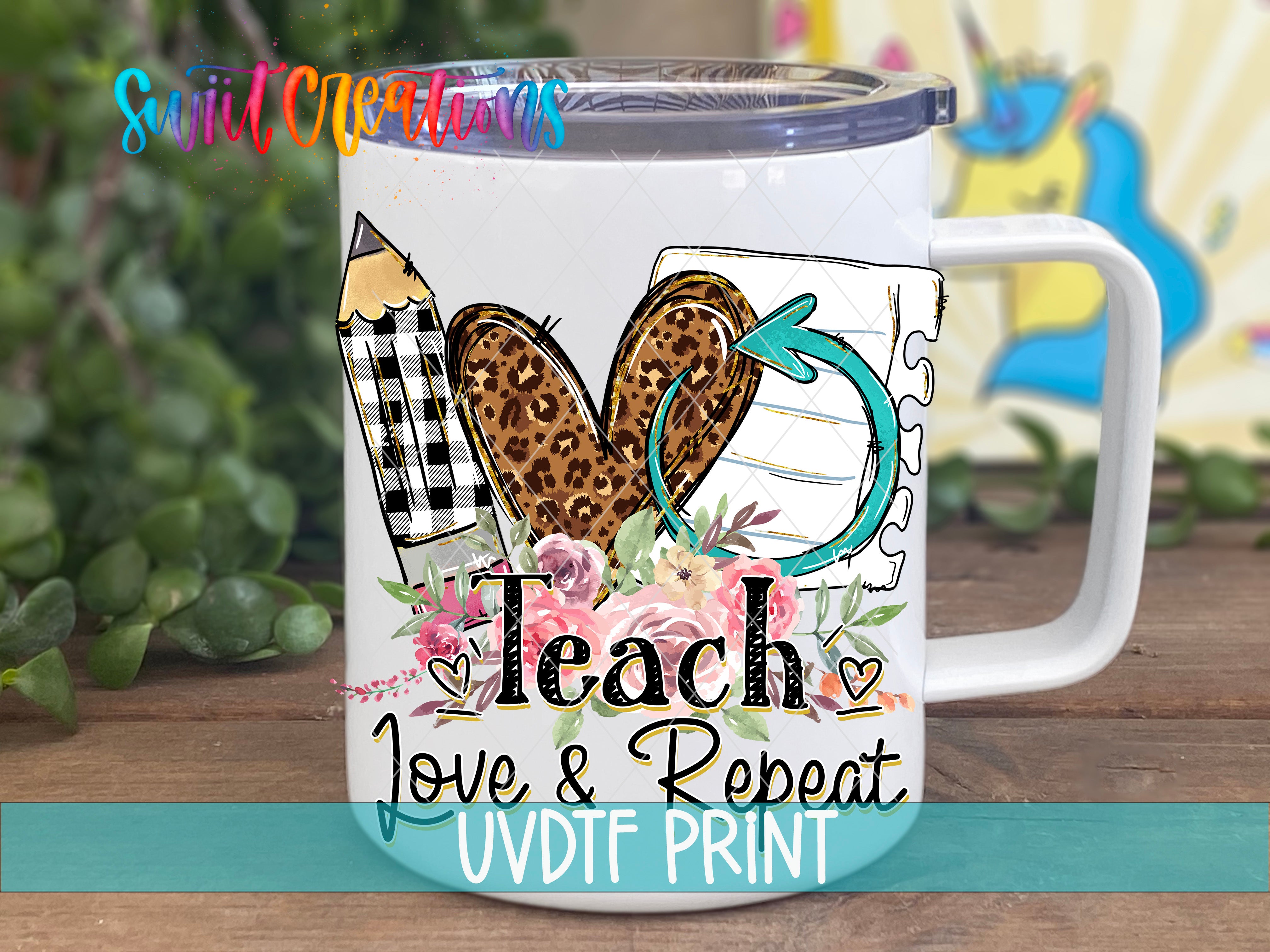 A white mug with a colorful design featuring a heart, pencil, and flowers, along with the text "Teach, Love & Repeat UVDF Print".