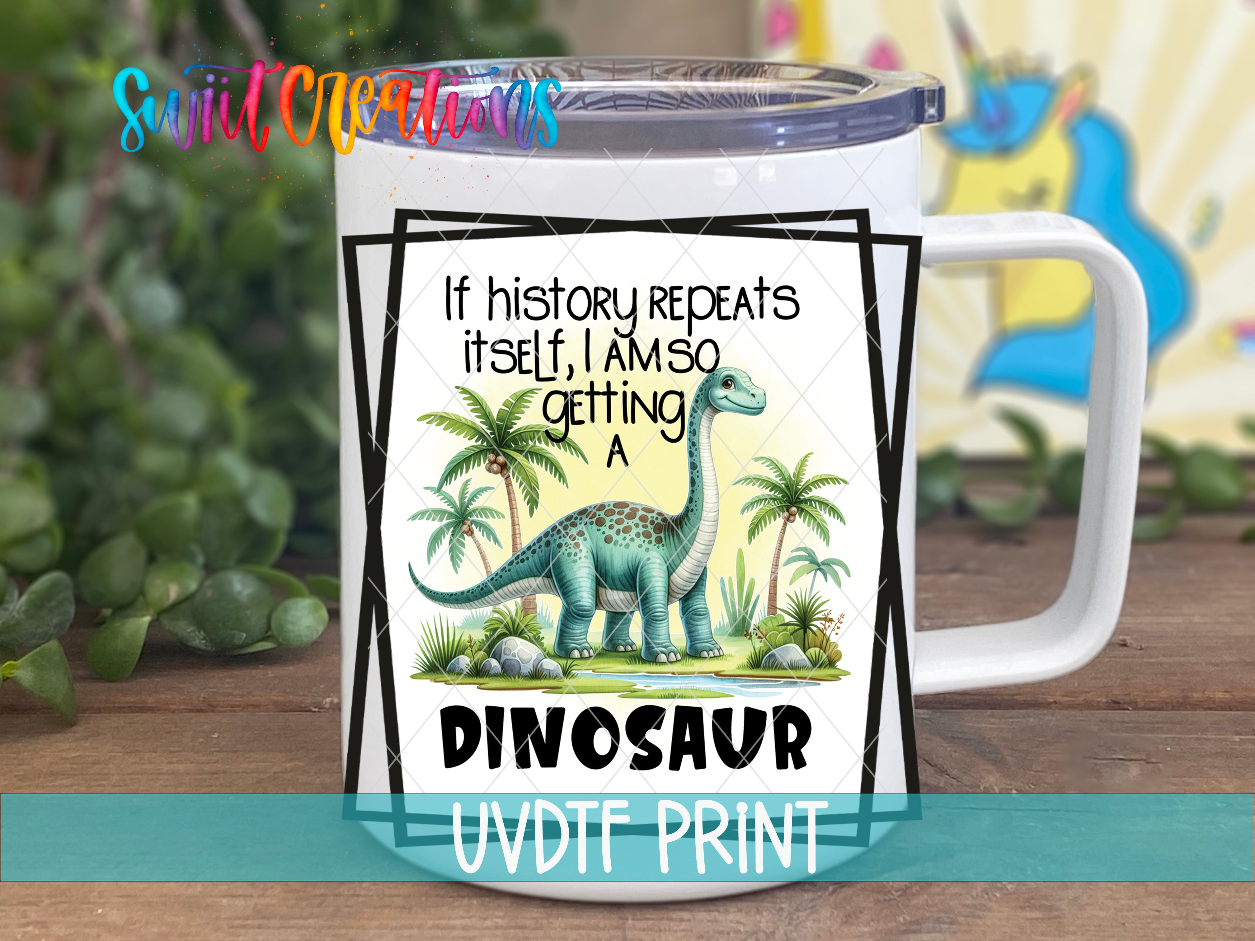A white mug with a dinosaur illustration and text on it, placed on a wooden surface.