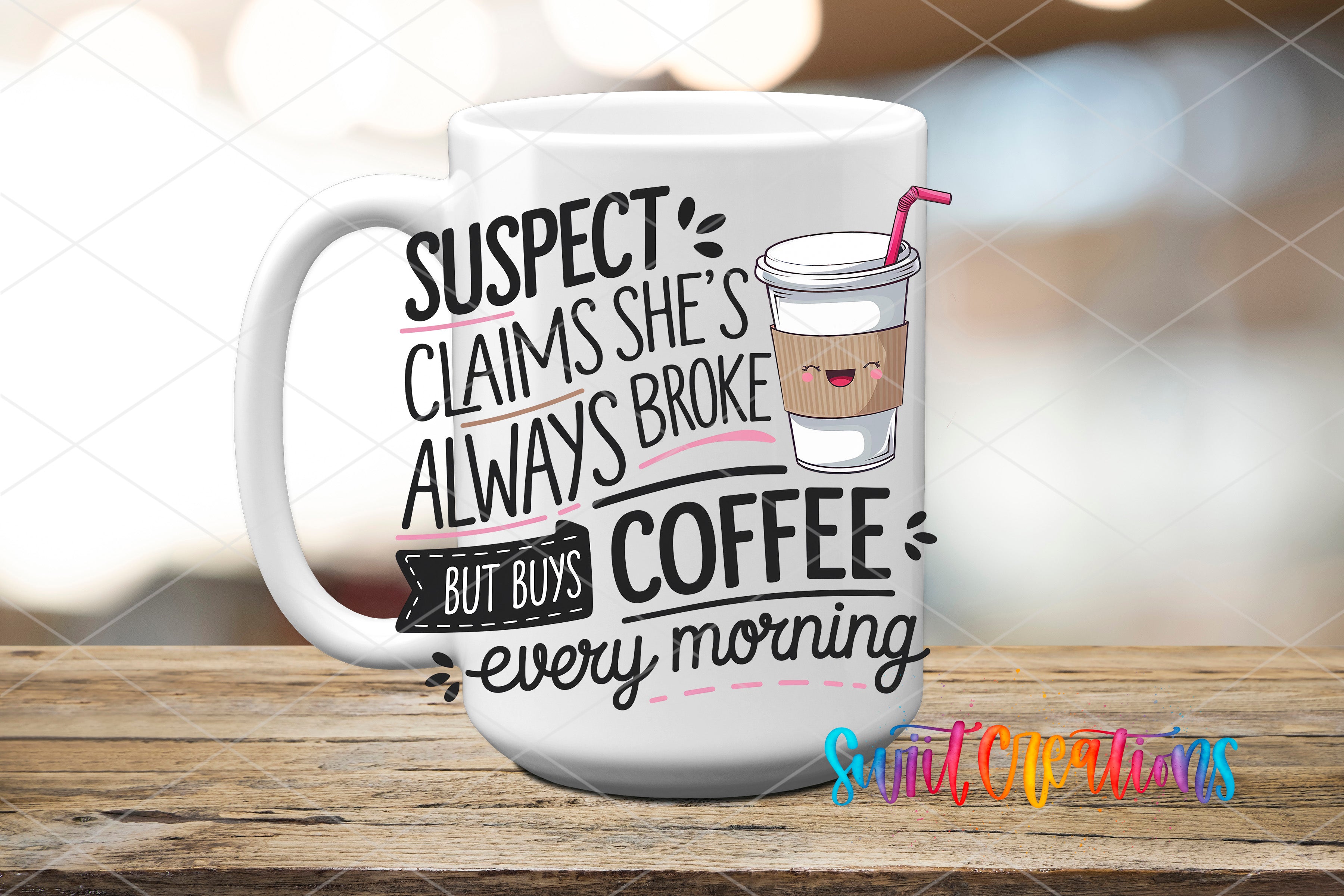A white coffee mug with text and an illustration of a coffee cup on it, placed on a wooden surface.