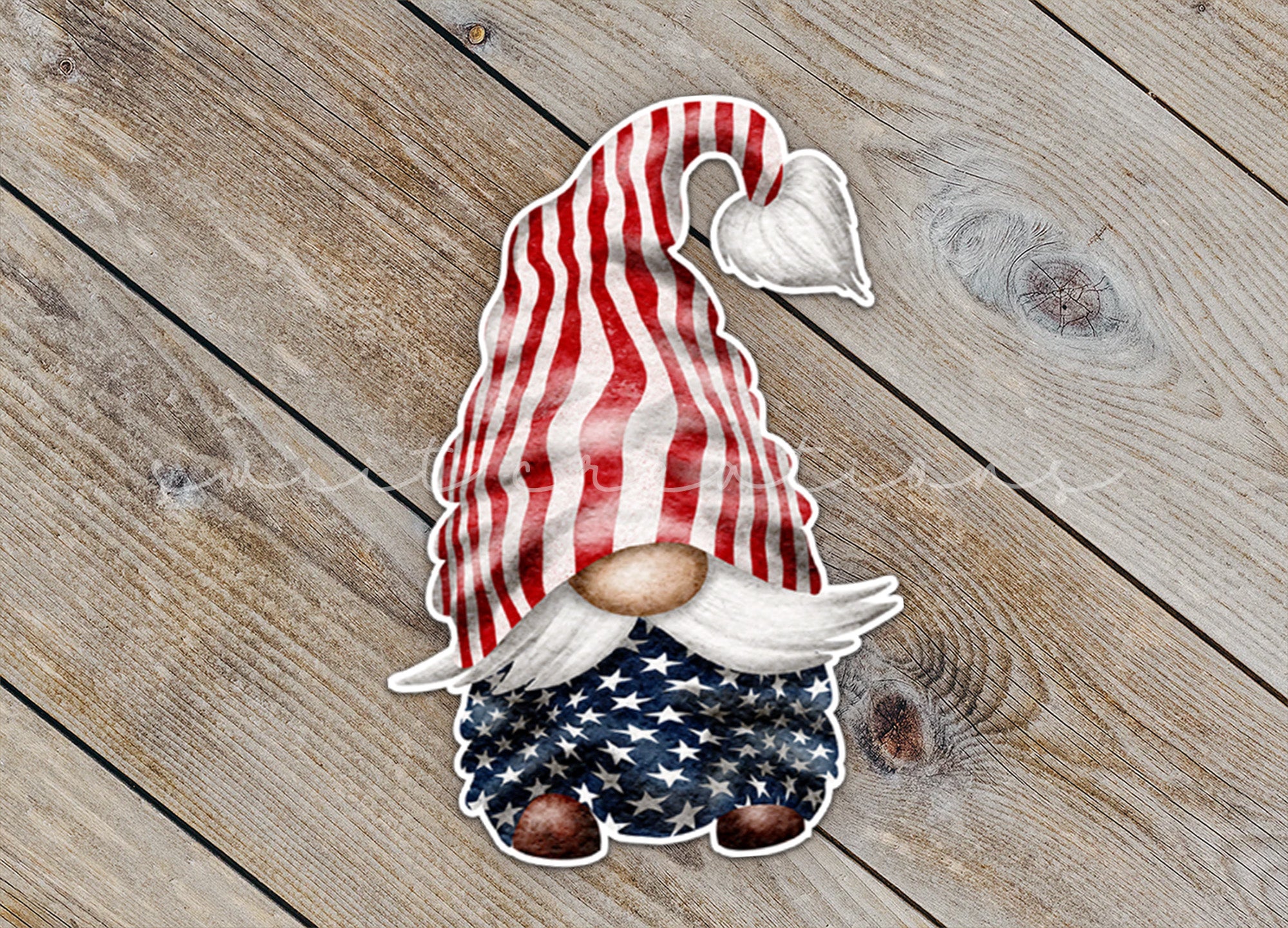 a paper cutout of a gnome with an american flag hat