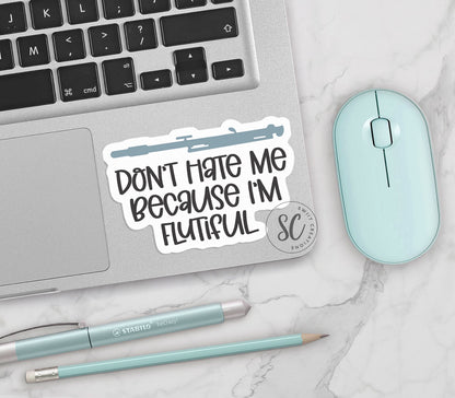 a sticker that says don't hate me because i'm flutist