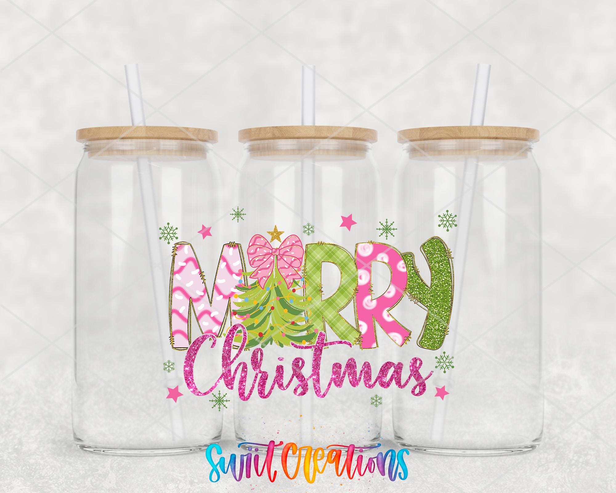 three clear glass jars with wooden lids, each with a straw. The jars are arranged in a row, and the front of each jar has a colorful design that says "Merry Christmas" in a festive font.