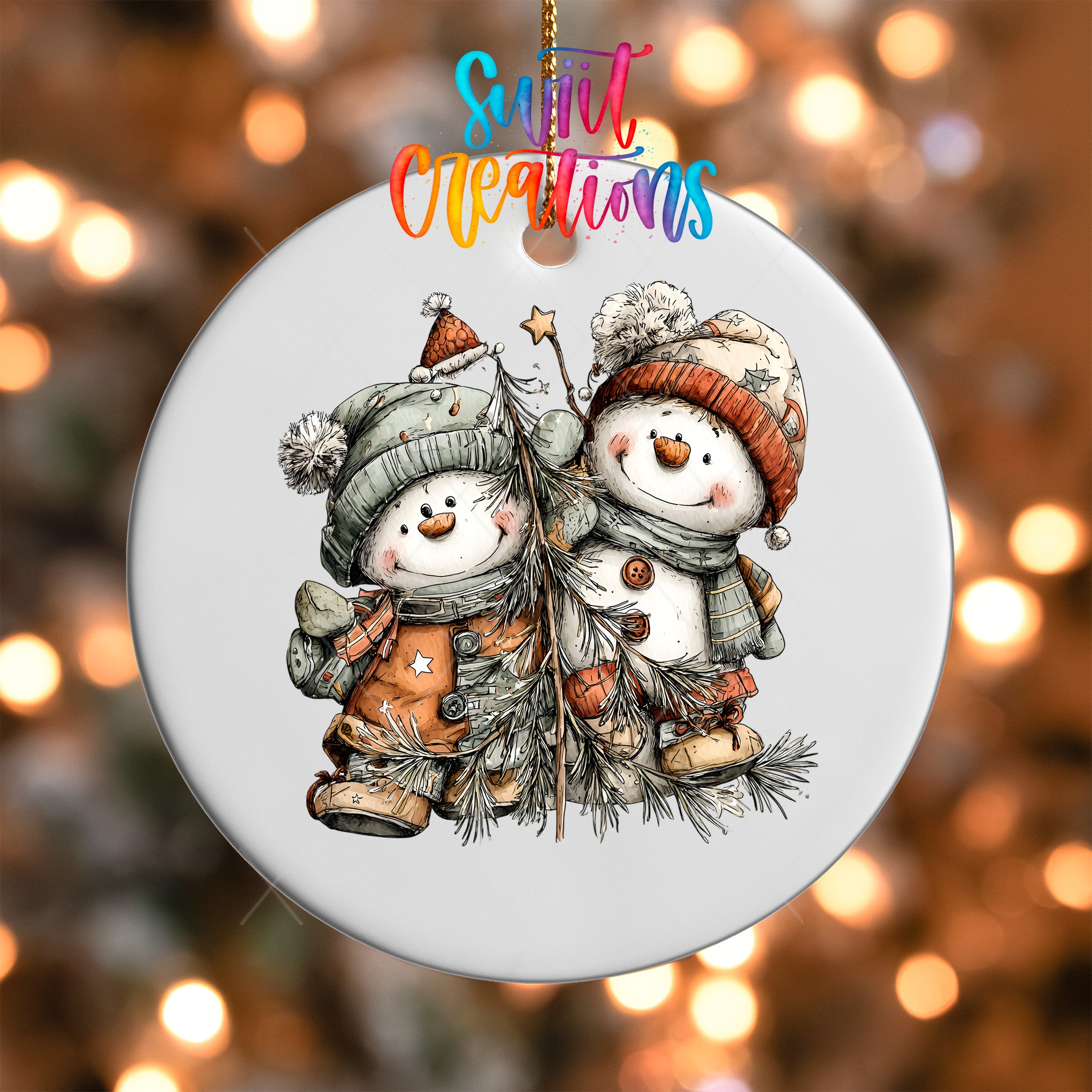 A white ornament featuring two snowmen, one wearing a red hat and the other a green hat, with Christmas trees and ornaments.
