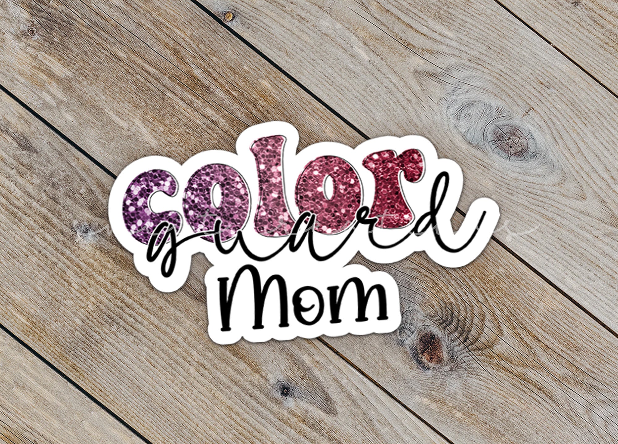 a close up of a sticker on a wooden surface