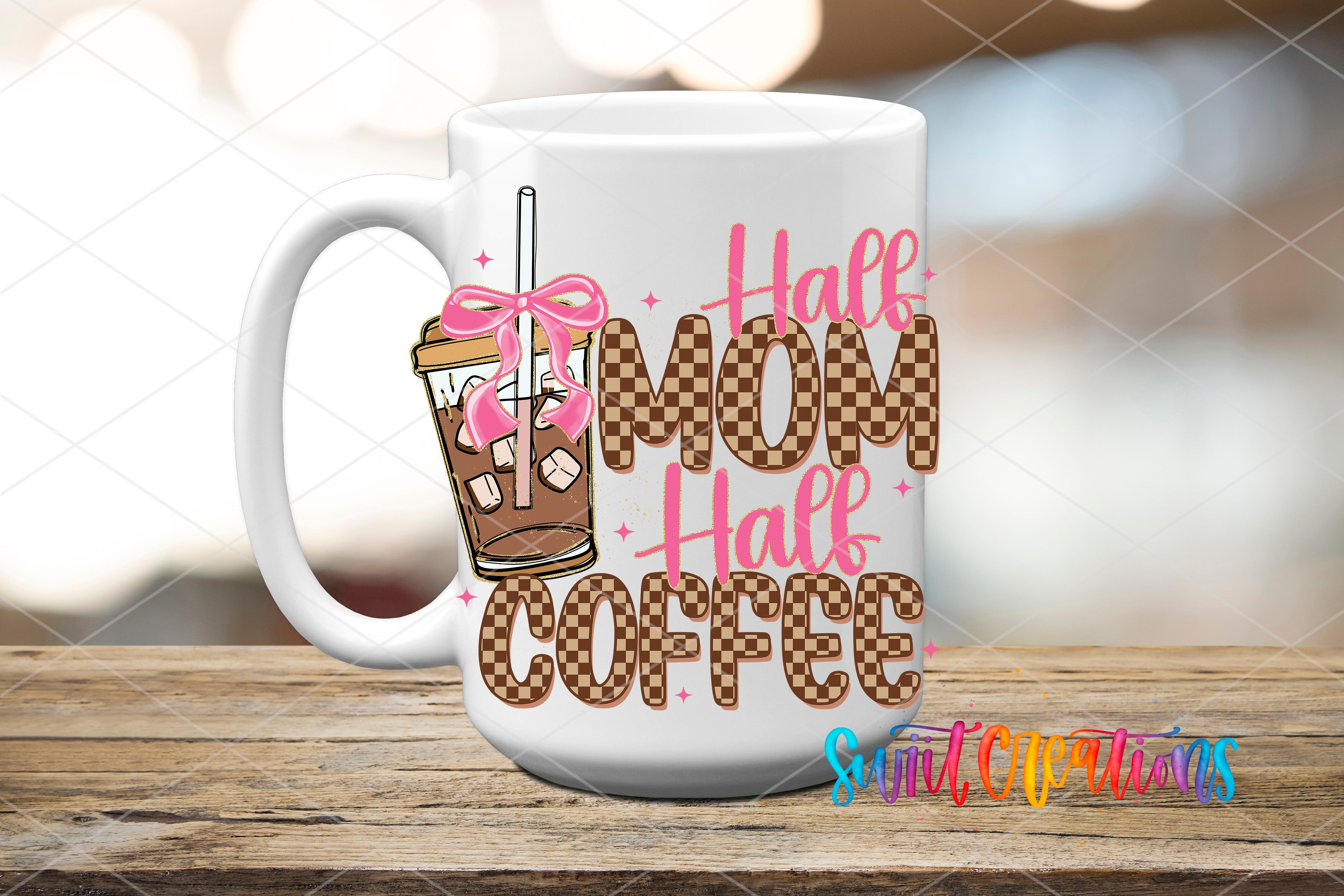 A white coffee mug with a design featuring a pink ribbon and the text "Half Mom Half Coffee" printed on it.