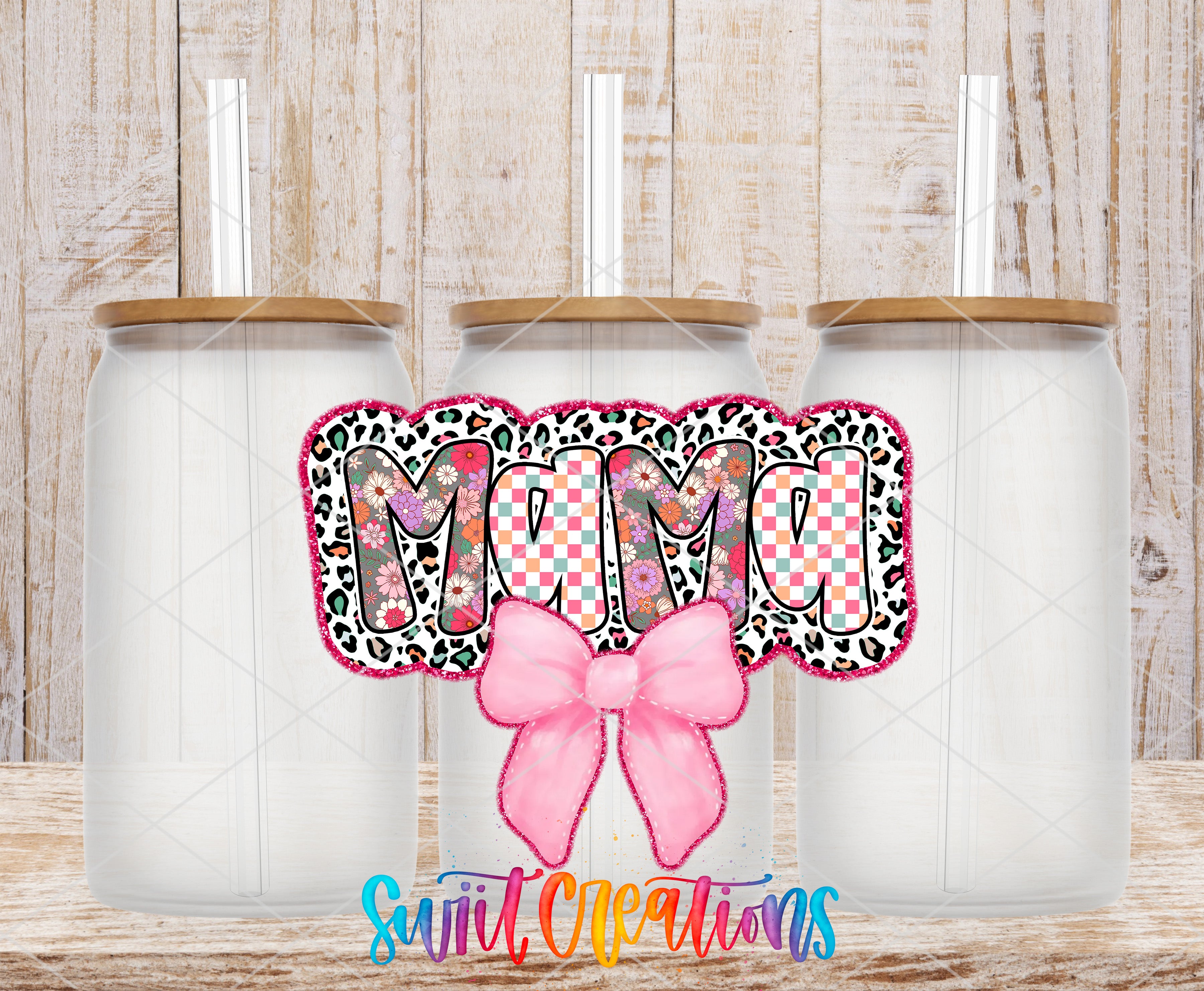 three clear glass jars with lids, each containing a straw, arranged in a row. The jars have a leopard print design on the lids, and the word "MUM" is written in a checkered pattern on the front of the jars. A pink bow is also present in the image.