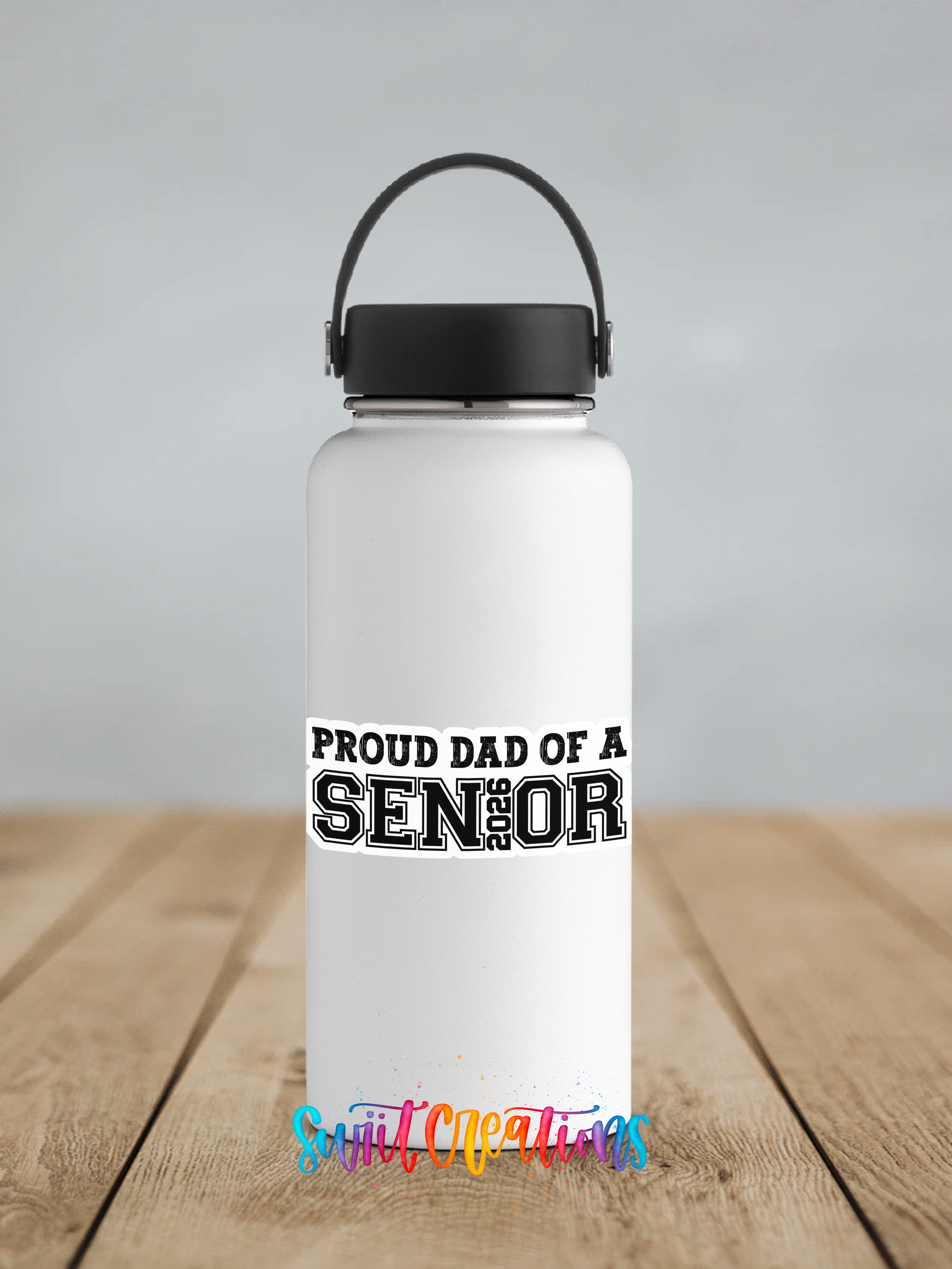 A white water bottle with a black handle and a black cap, featuring a sticker that says "Proud dad of a SENIOR".