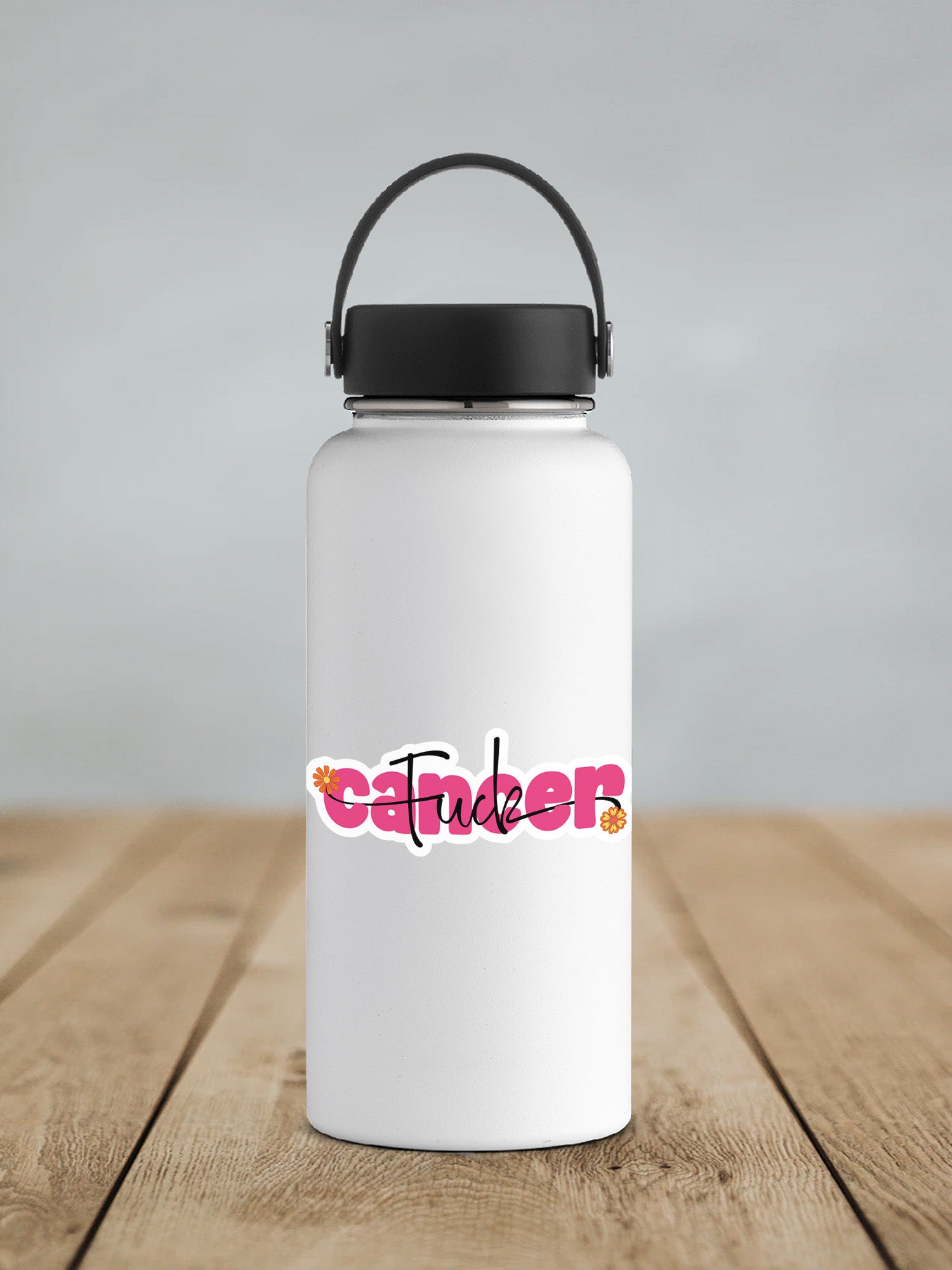 a white water bottle sitting on top of a wooden table