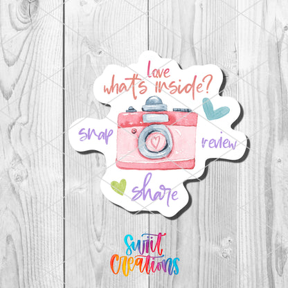 a sticker with the words love, whats inside? and a picture of